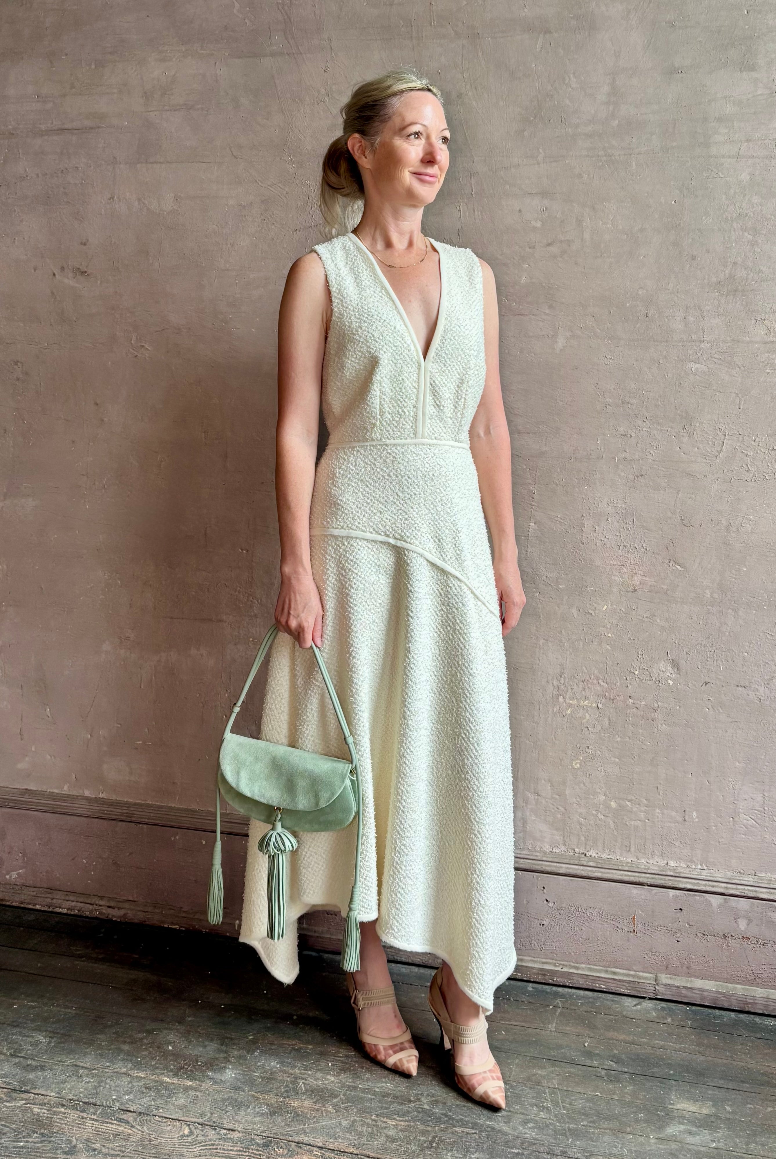 Woman wearing luxury Ulla Johnson Florence Dress concealed zip closure sleeveless fit and flare design
