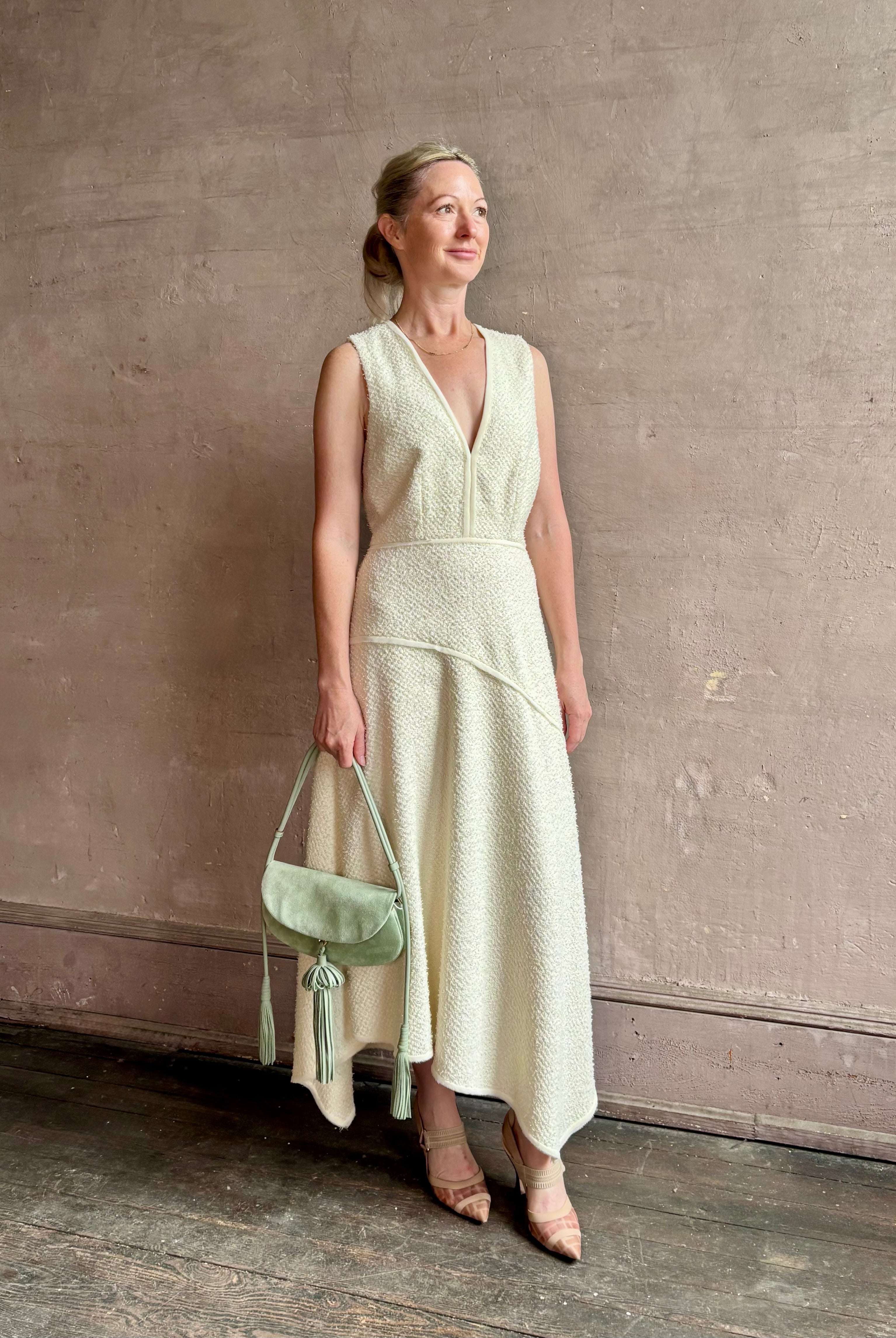 Woman wearing luxury Ulla Johnson Florence Dress concealed zip closure sleeveless fit and flare design
