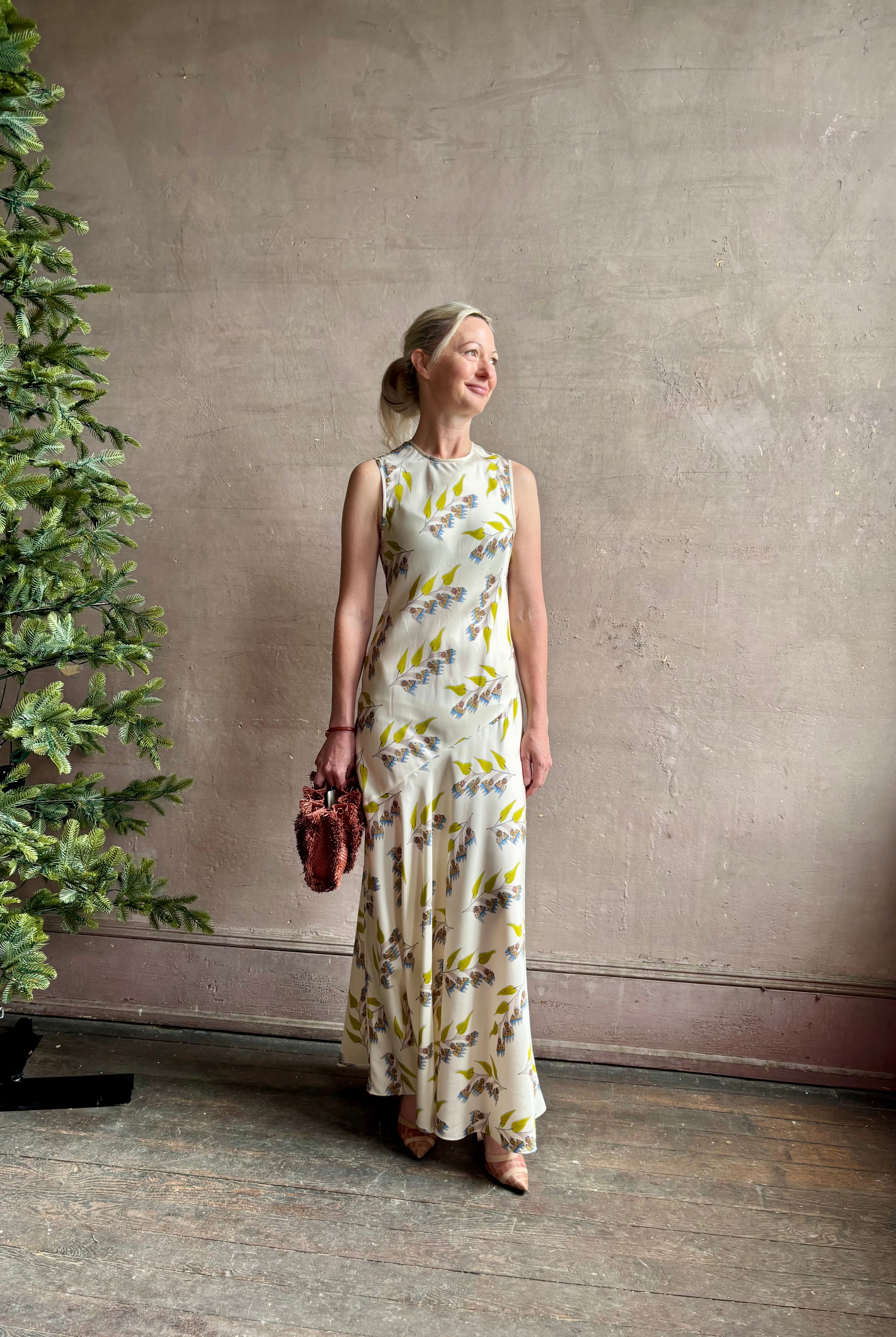 Mature woman wearing Ulla Johnson Gaea designer silk dress Infinite Flower print Czech artist Anna Zemankova collaboration