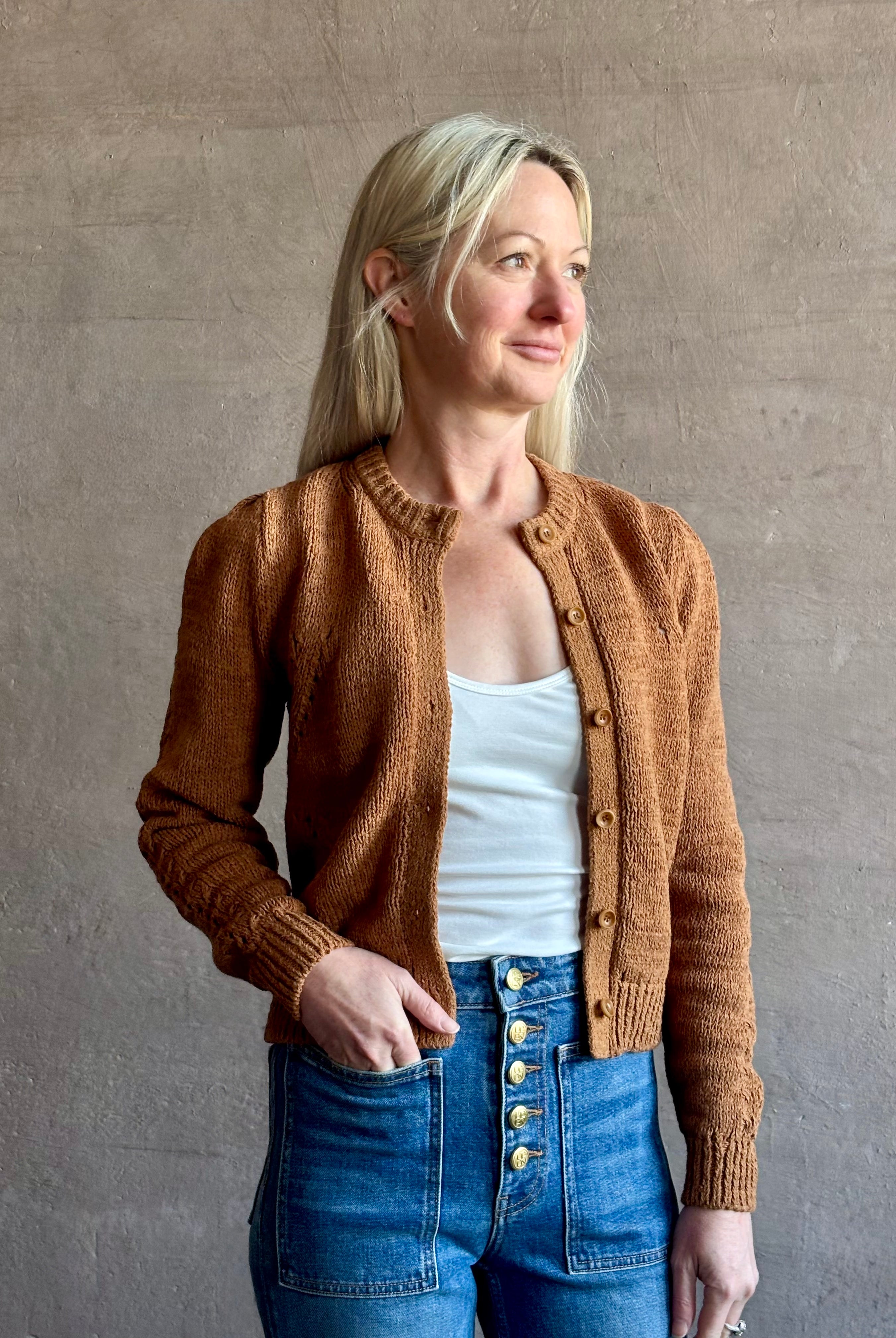 Woman wearing women's designer denim the Lou Jean from Ulla Johnson handcrafted in USA with gold buttons, front pockets and straight legs in medium wash denim