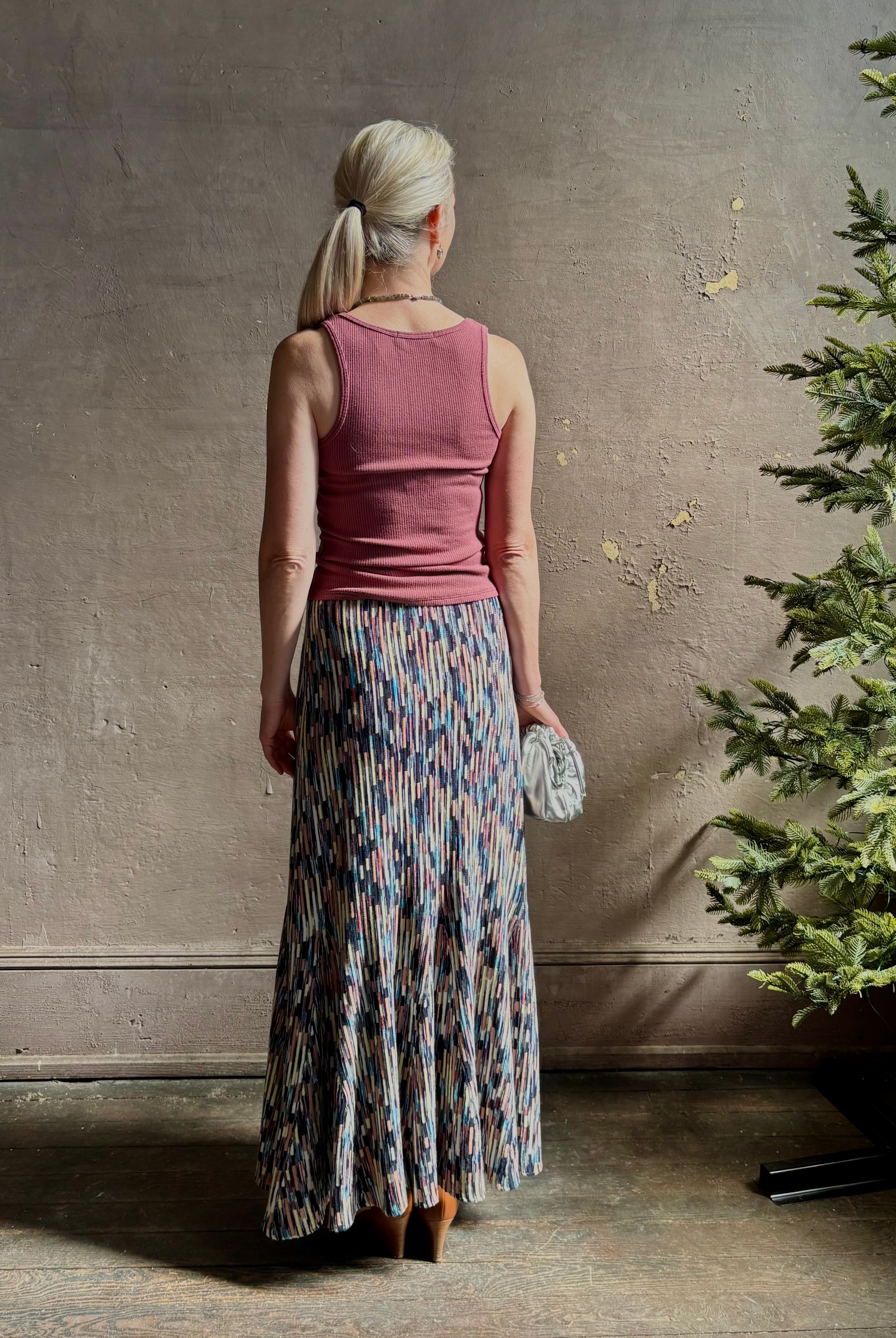 Mature woman wearing Ulla Johnson Marceline maxi knit cotton Skirt women's designer knit skirt Oasis colorway