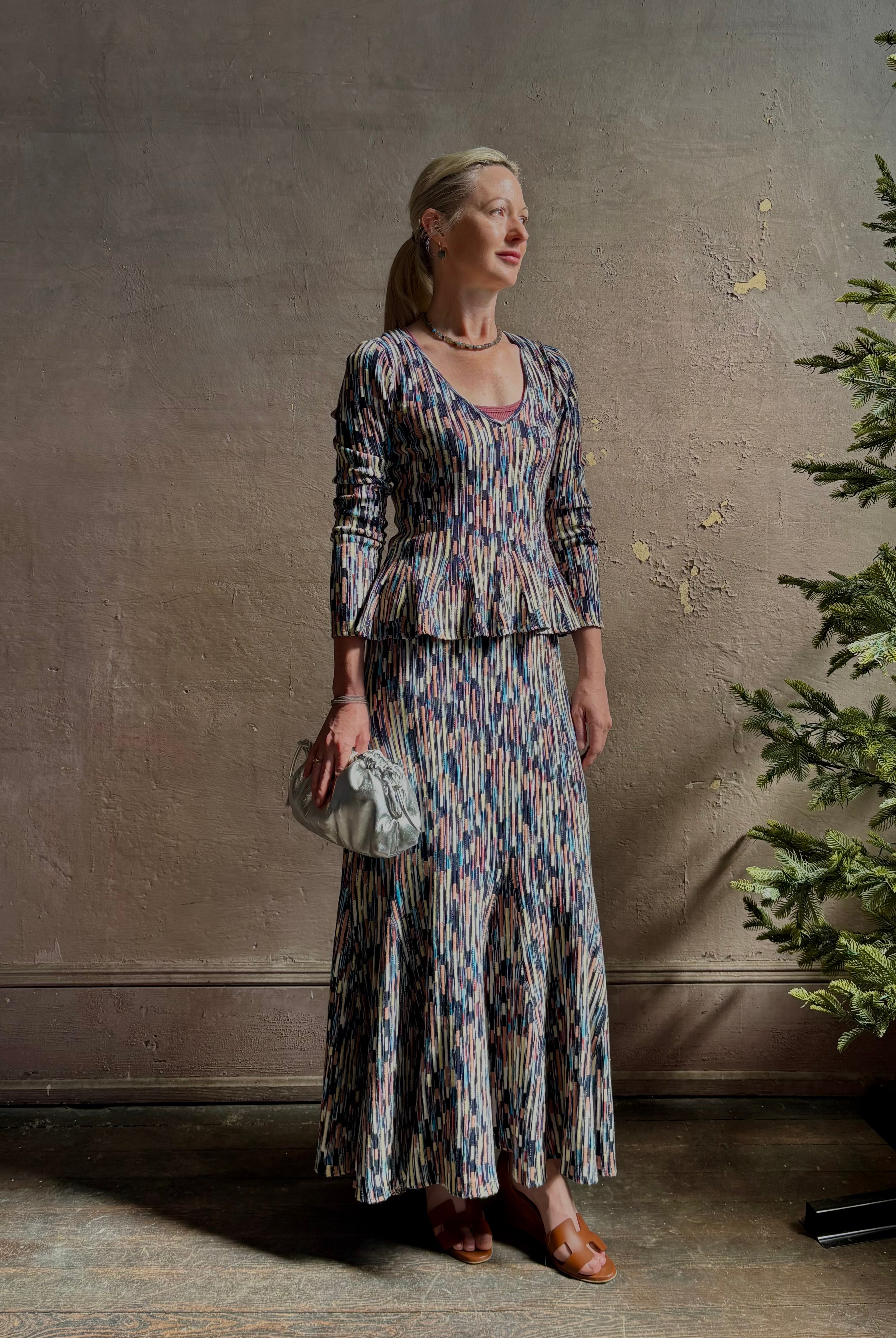 Mature woman wearing Ulla Johnson Marceline maxi knit cotton Skirt women's designer knit skirt Oasis colorway