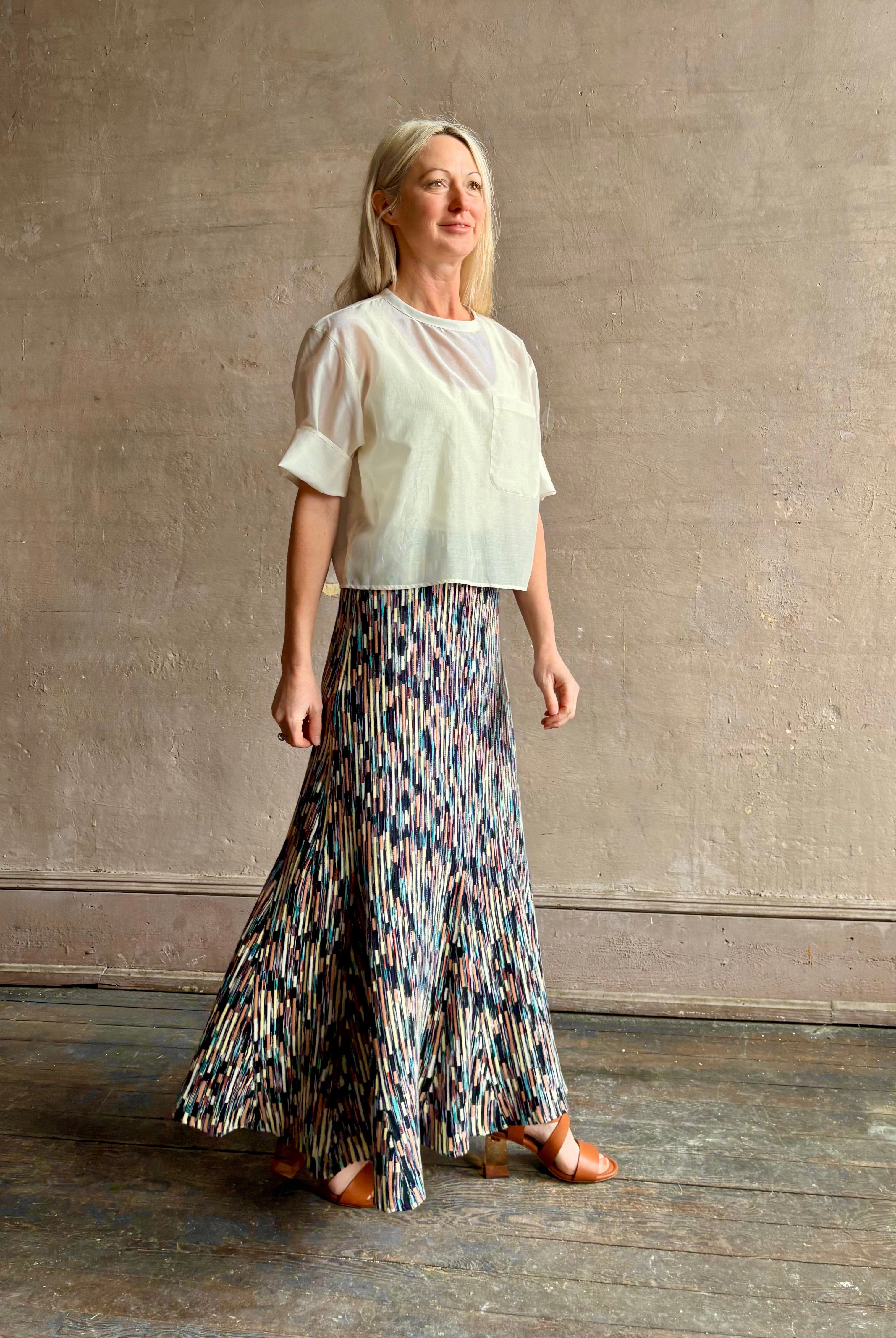 Mature woman wearing Ulla Johnson Marceline maxi knit cotton Skirt women's designer knit skirt Oasis colorway