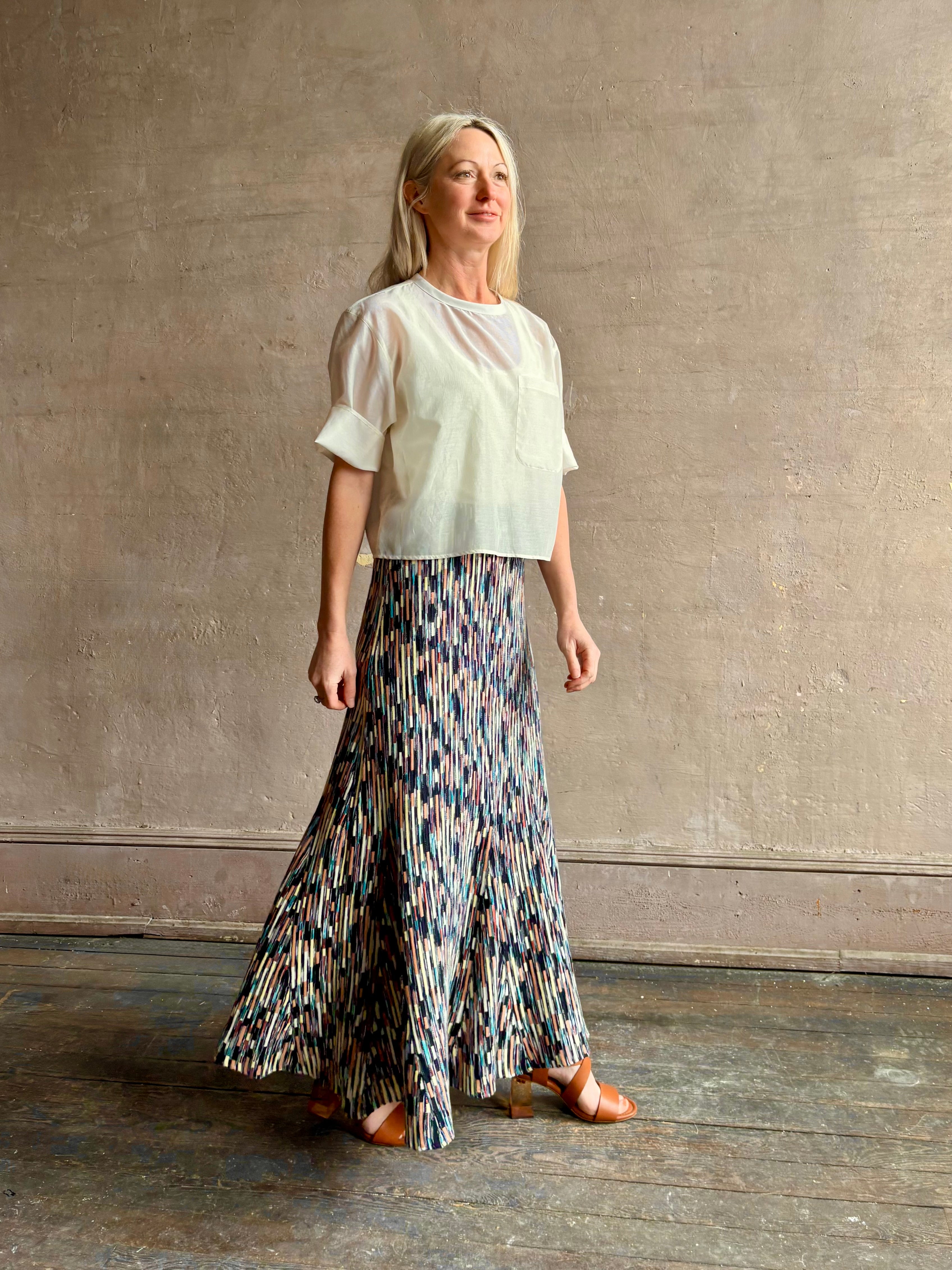 Mature woman wearing Ulla Johnson Marceline maxi knit cotton Skirt women's designer knit skirt Oasis colorway
