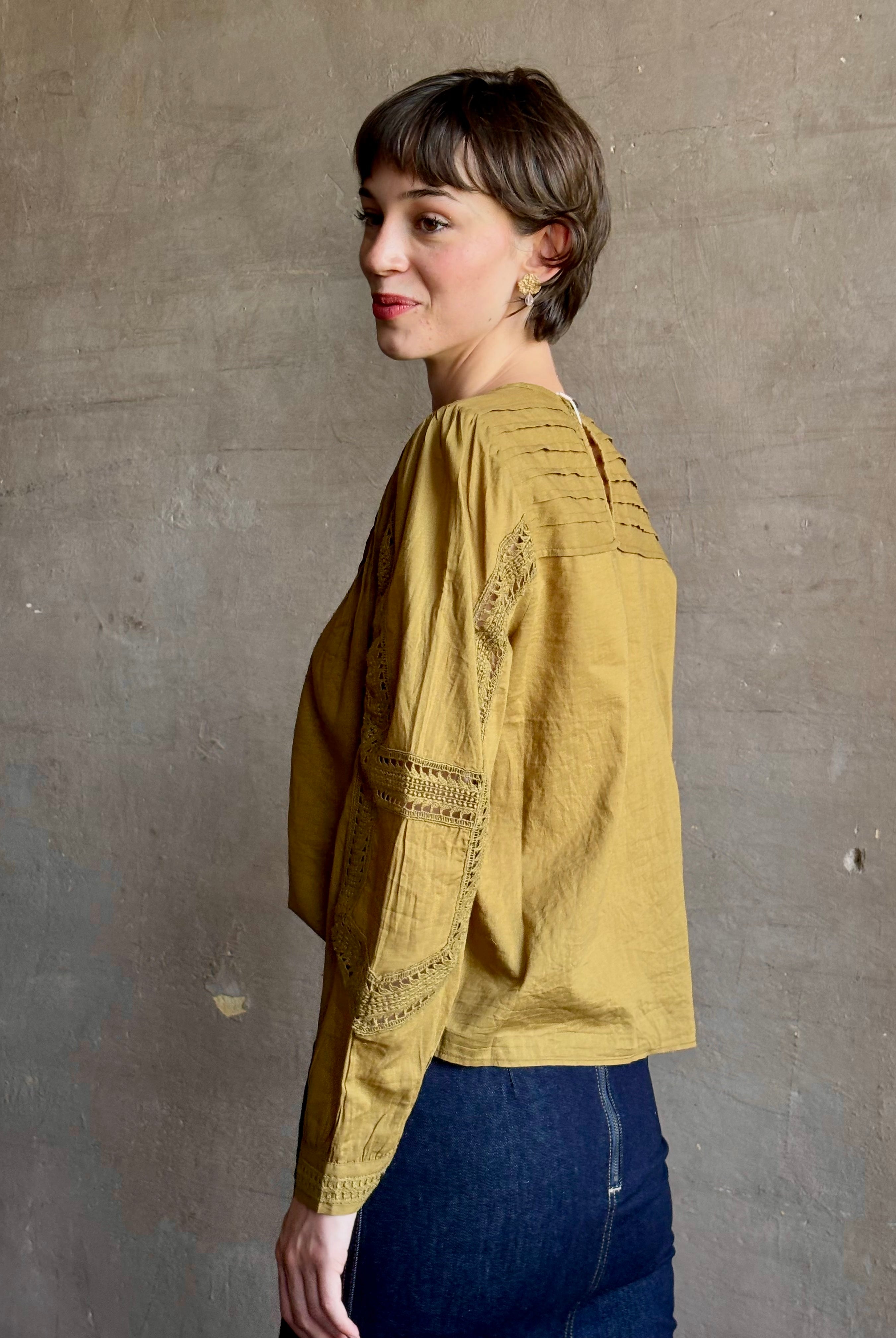 Ulla Johnson Marlowe Long Sleeve Cotton Top in muted green with pintucking and intricate lace crochet