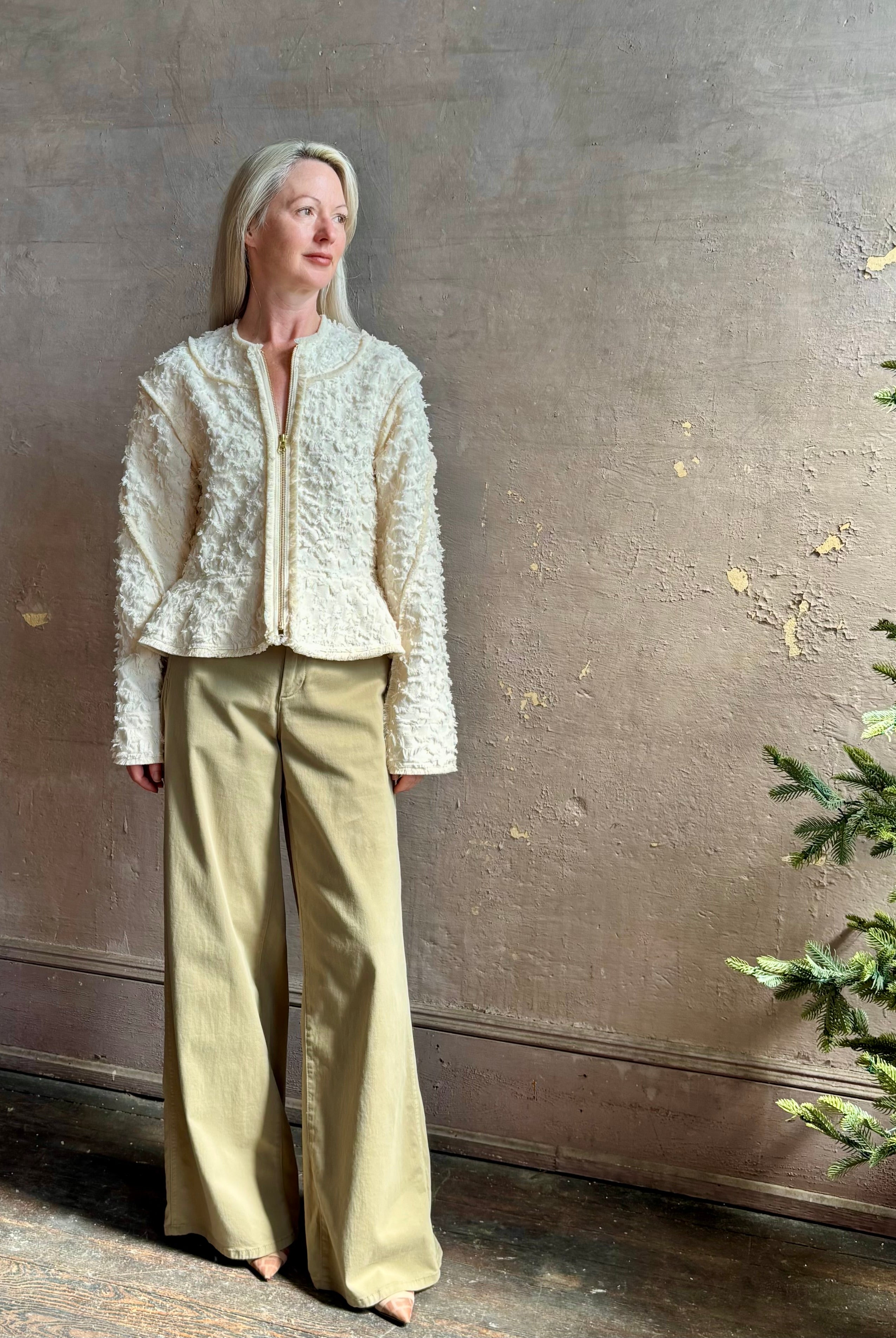 woman wearing designer Ulla Johnson Rosalind tailored peplum premium cotton Jacket checkered fringe texture
