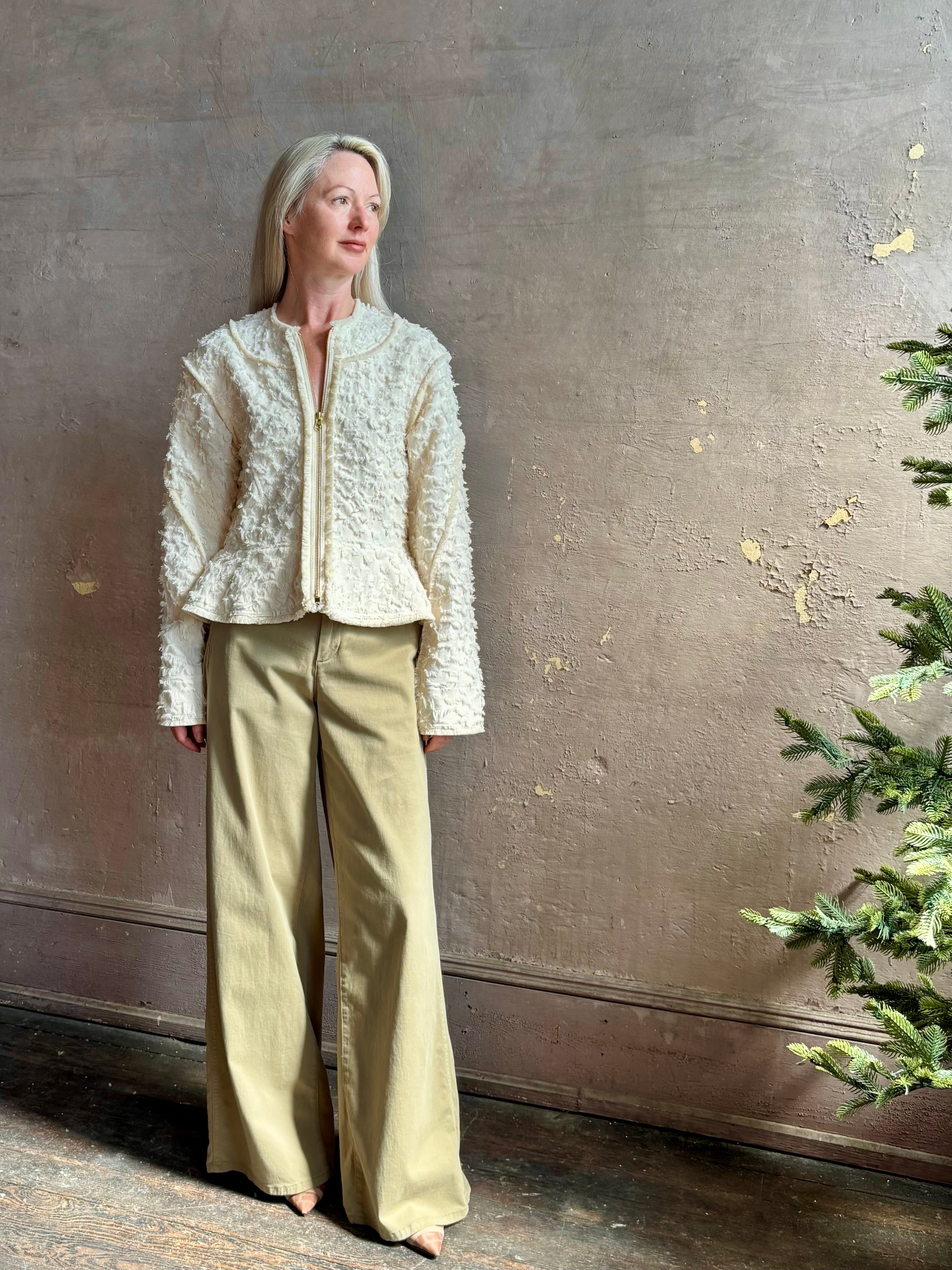 woman wearing designer Ulla Johnson Rosalind tailored peplum premium cotton Jacket checkered fringe texture