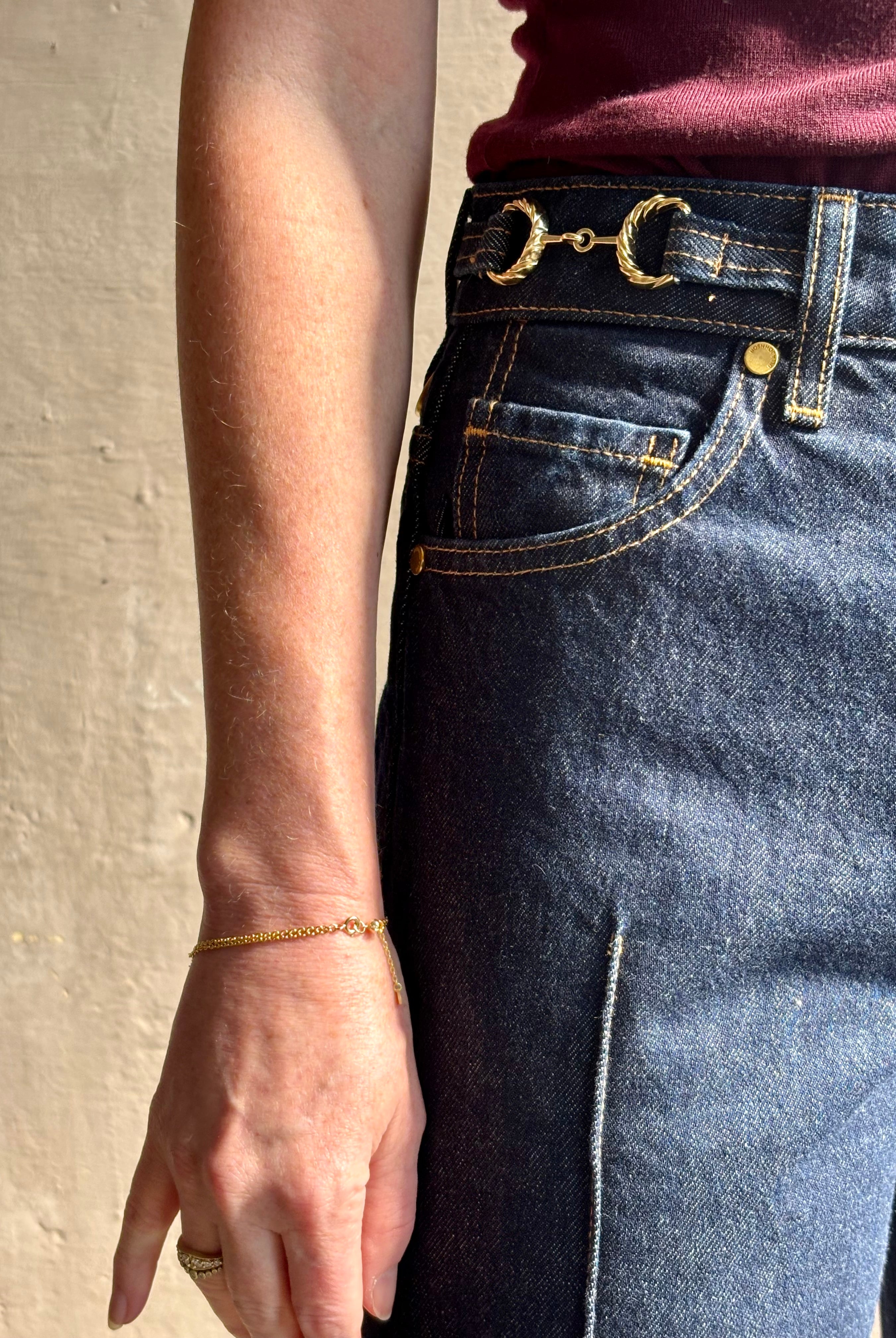 Woman wearing ULLA JOHNSON Agatha Straight Leg Pintuck Rigid Denim jean in Tigris wash with horsebit detail
