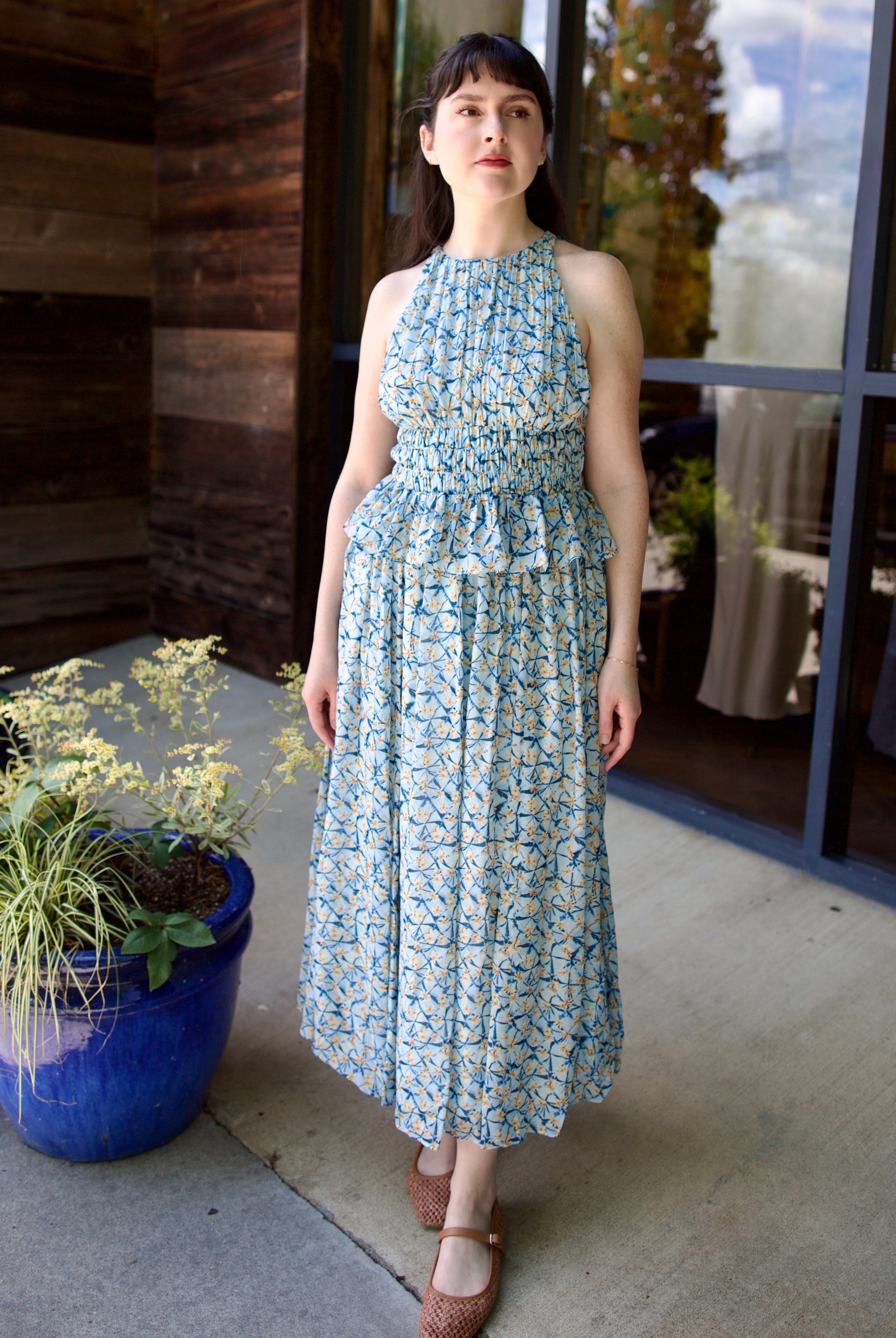 Model wearing designer Ulla Johnson Adeline dress in lightweight silk fabric with elegant feminine details for a flattering silhouette