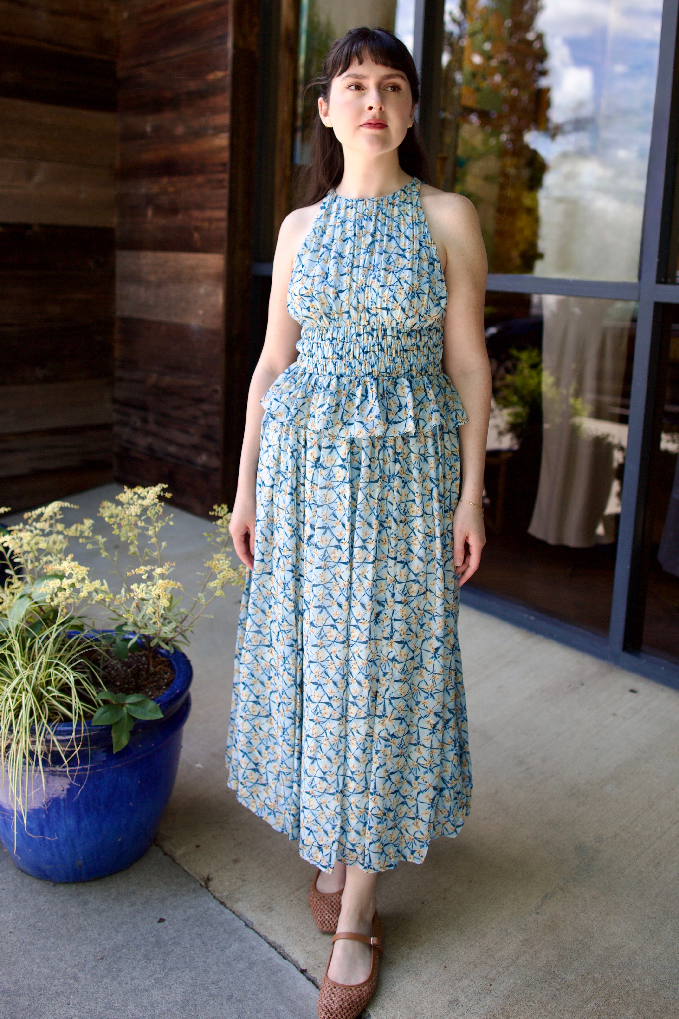 Model wearing designer Ulla Johnson Adeline dress in lightweight silk fabric with elegant feminine details for a flattering silhouette