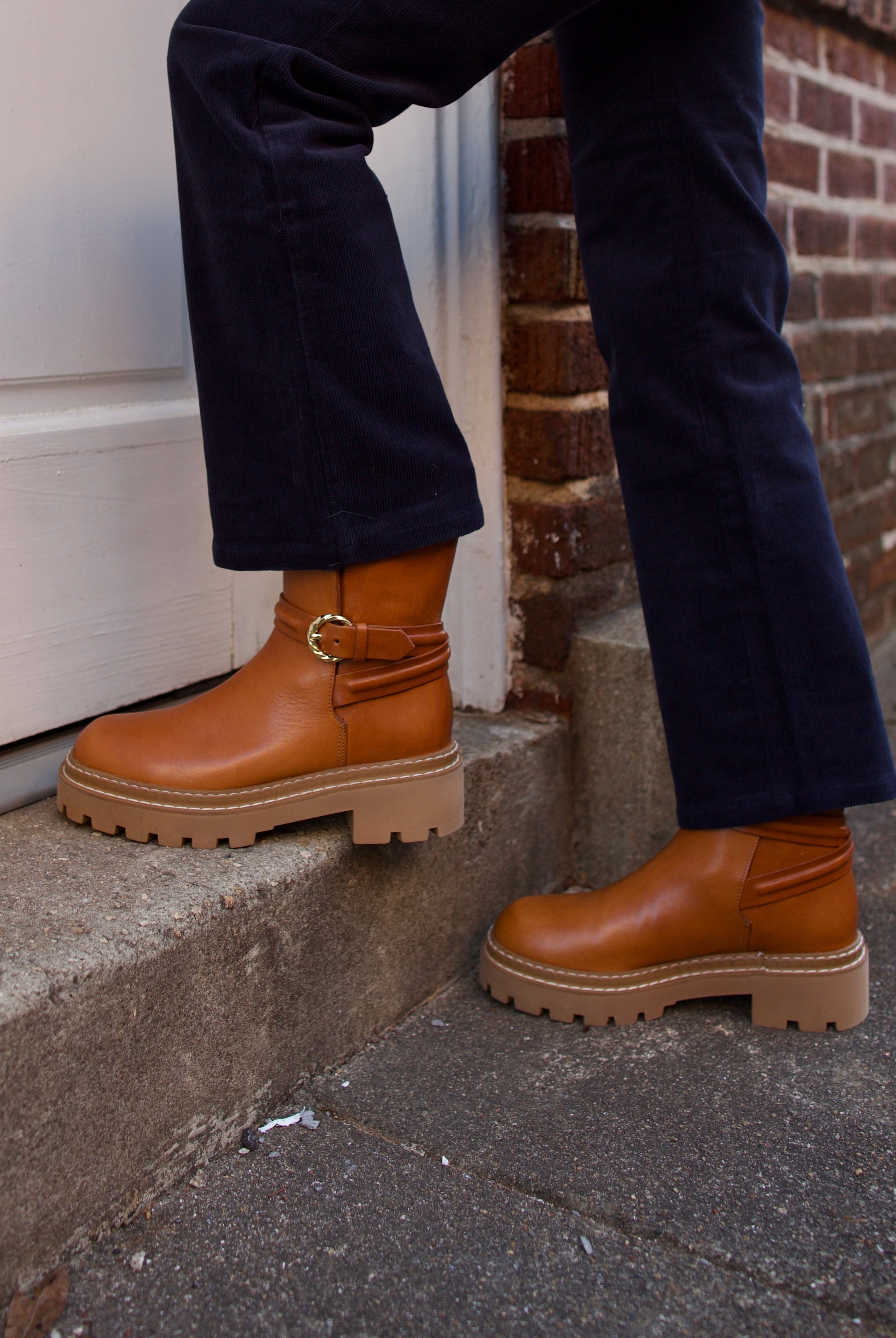 Image of woman wearing the Ulla Johnson Lennon Lugsole Boots