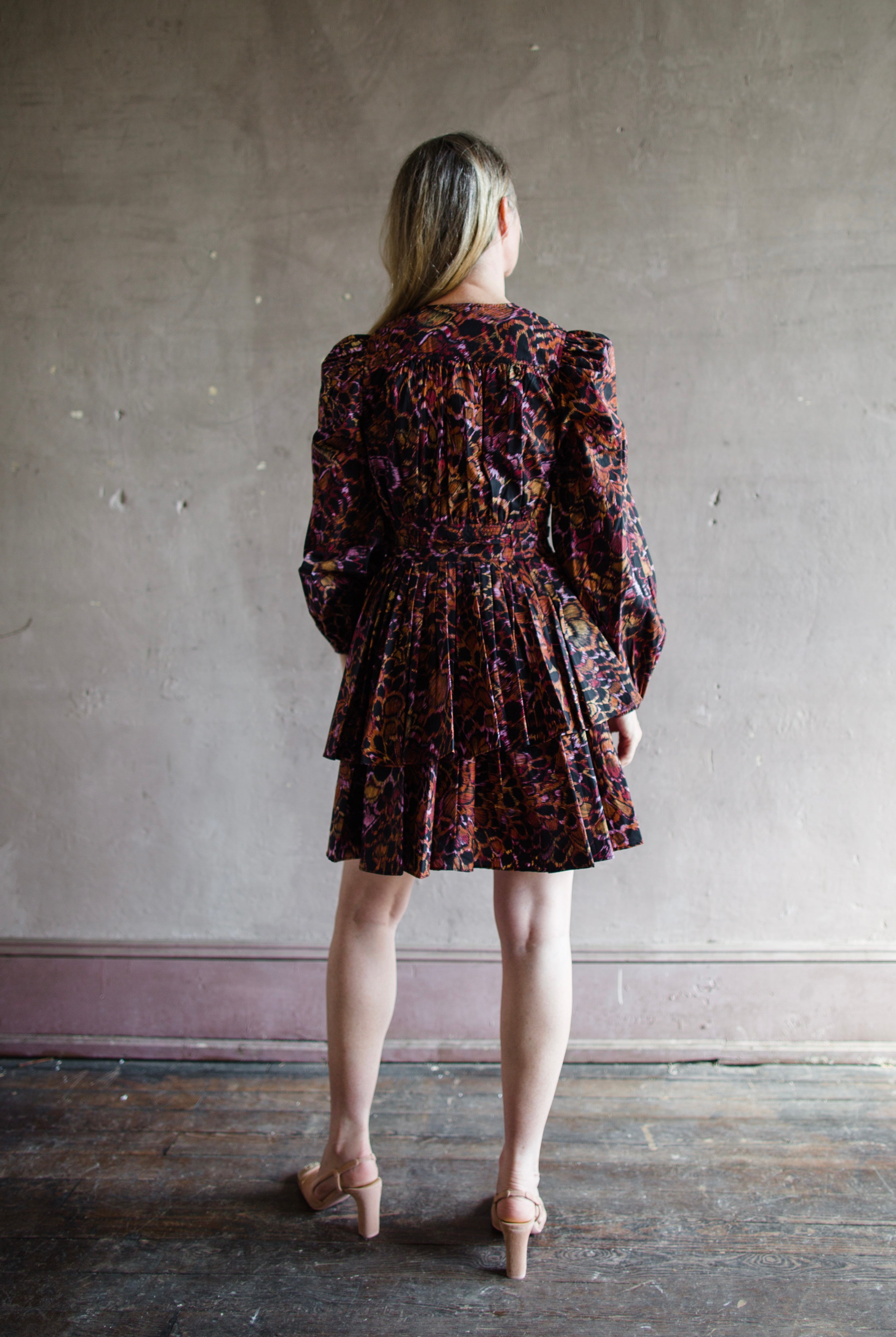 The Lulu cotton mini dress by Ulla Johnson features a v neckline with puff sleeves, tiered skirting and tailored bodice.