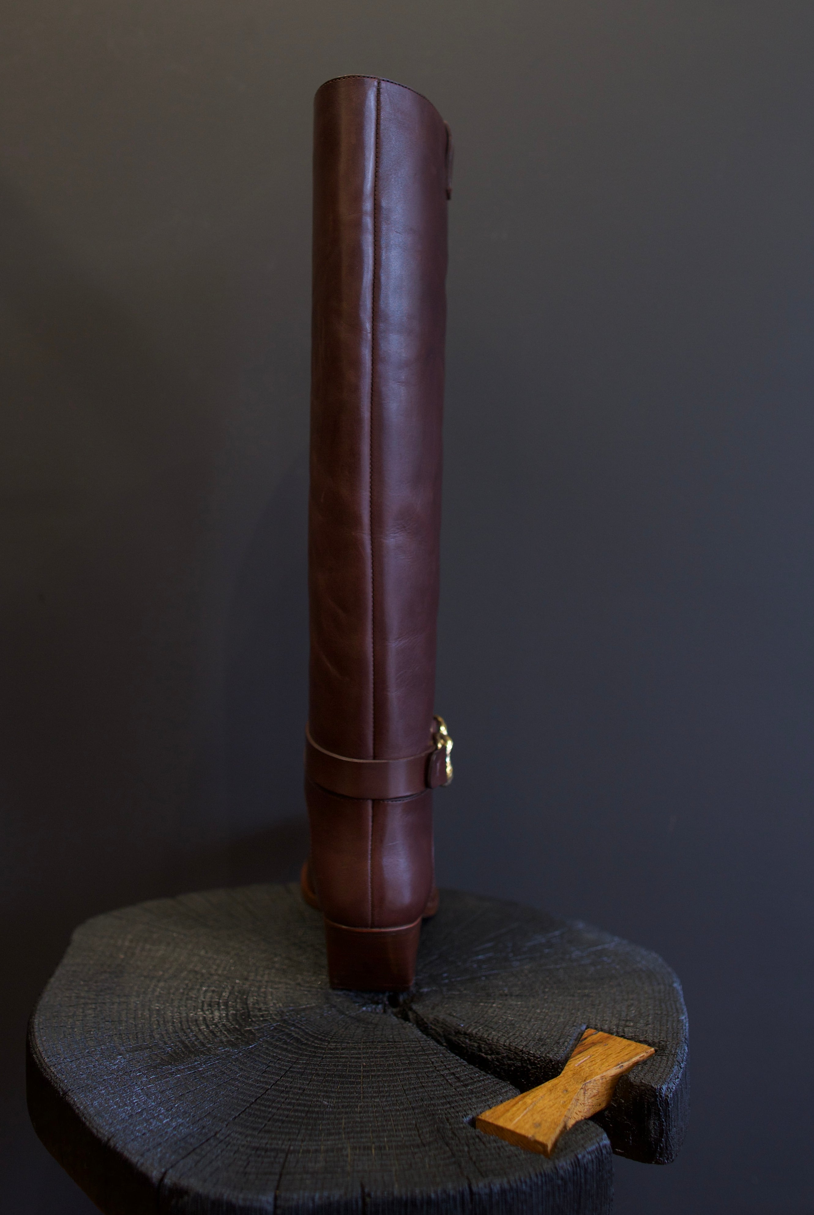 Image of the Ulla Johnson willow cowboy boot with a  knee-high length, pointed toe, and rests on a stacked block heel.