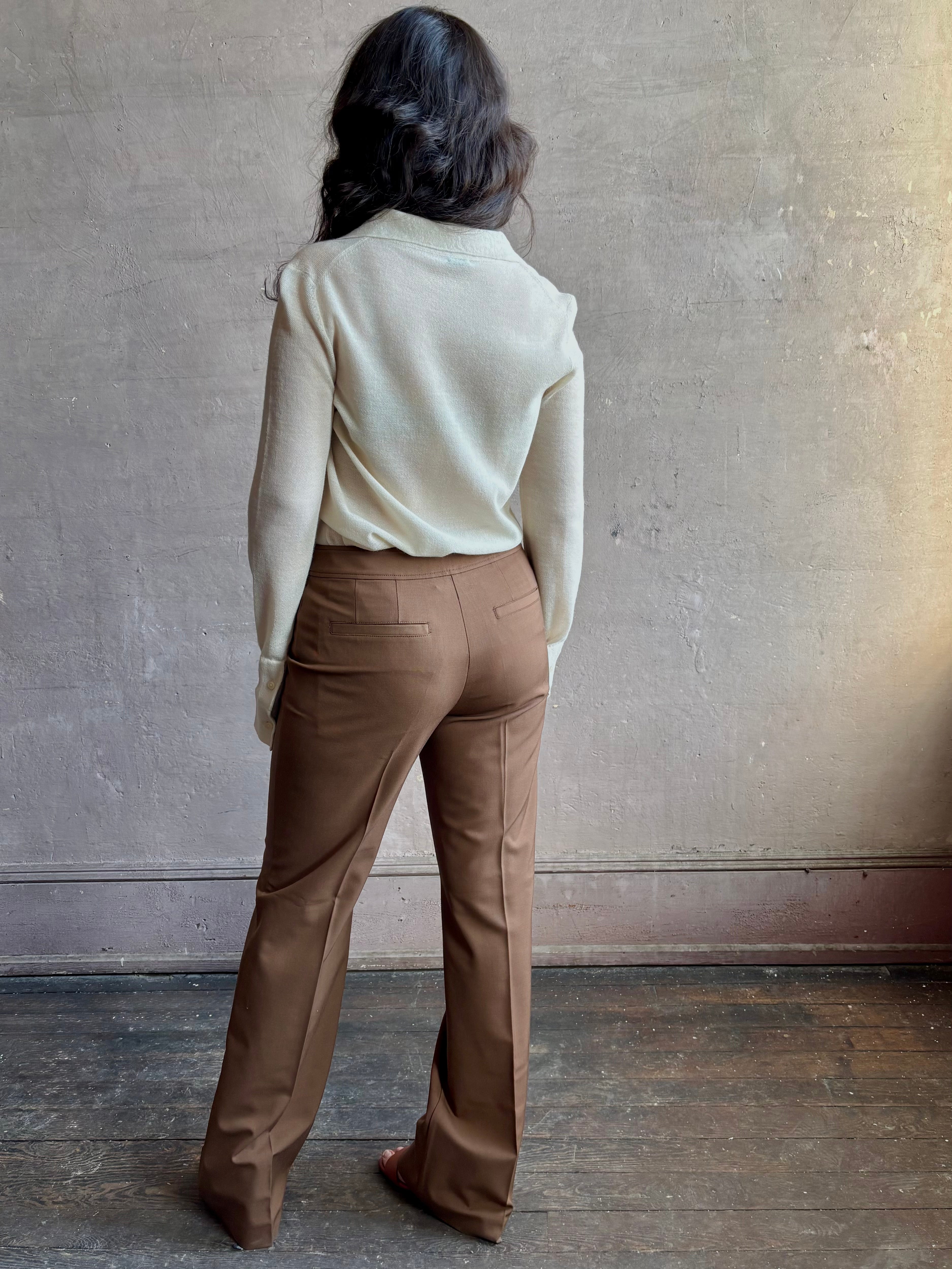 Image of woman wearing premium wool tailored blanca trousers by luxury designer Ulla Johnson Blanca in a neutral medium brown