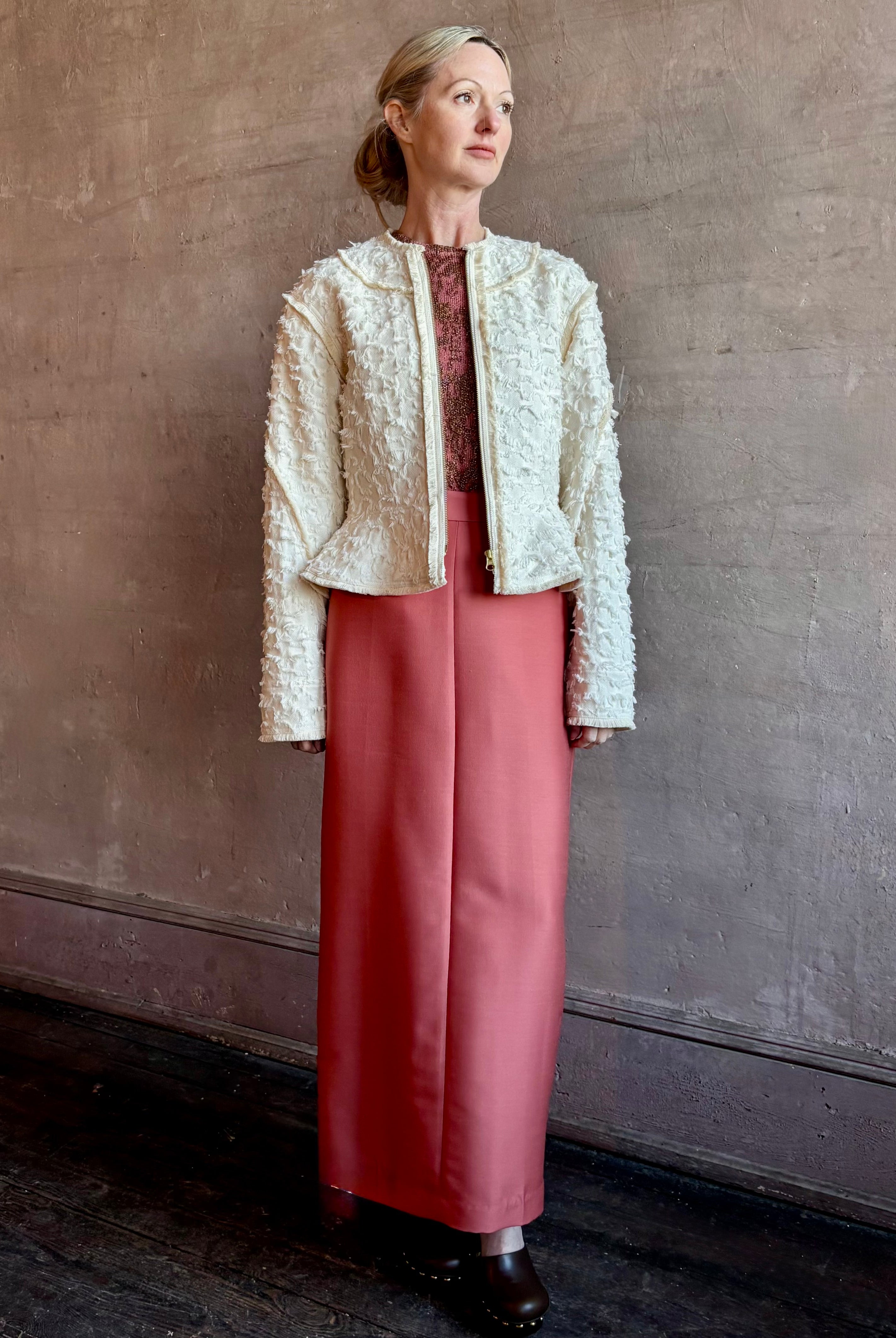 Image of woman wearing designer Ulla Johnson Rosalind tailored peplum Jacket in Premium Cotton with checkered fringe texture