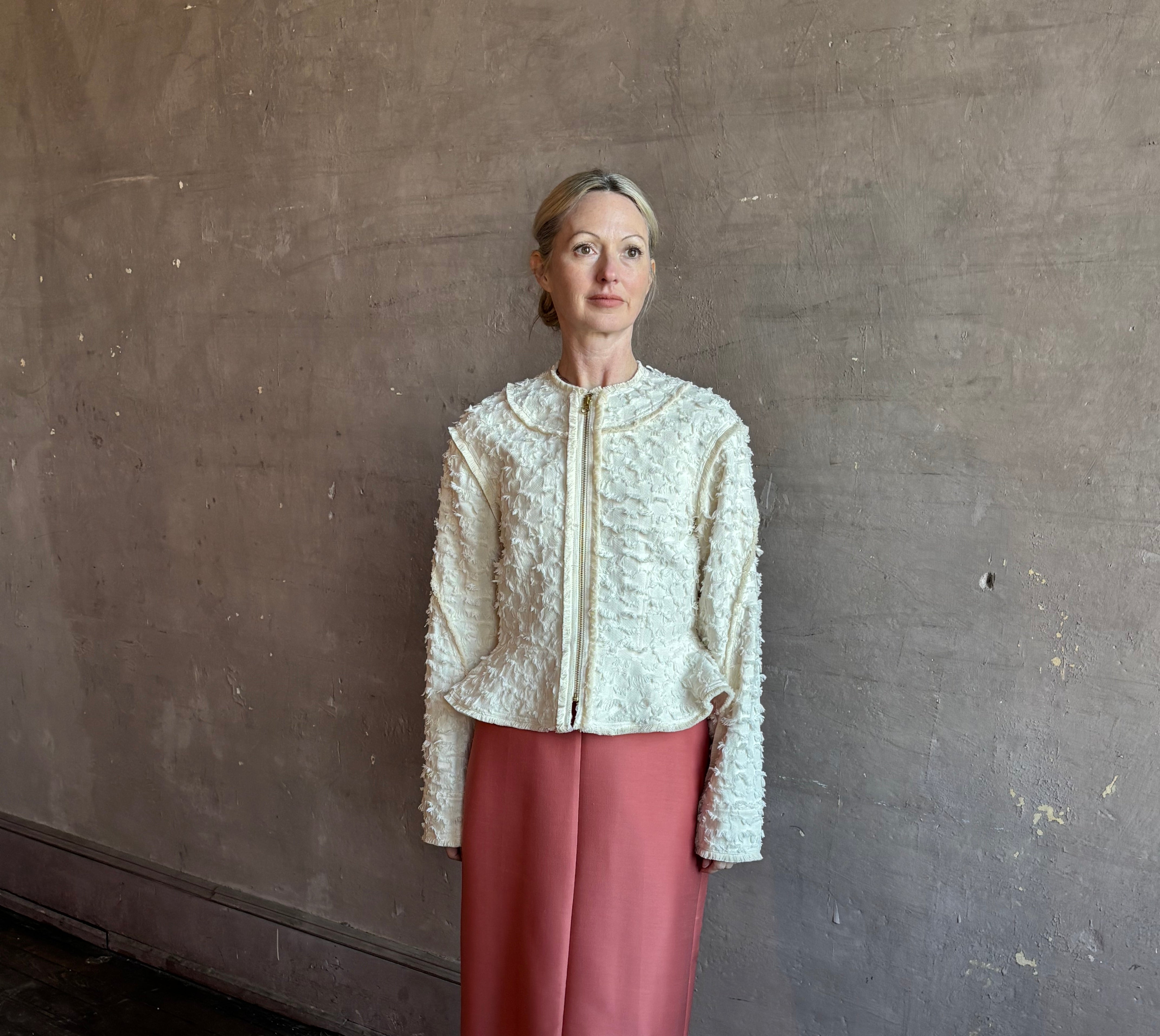 Image of woman wearing designer Ulla Johnson Rosalind tailored peplum Jacket in Premium Cotton with checkered fringe texture