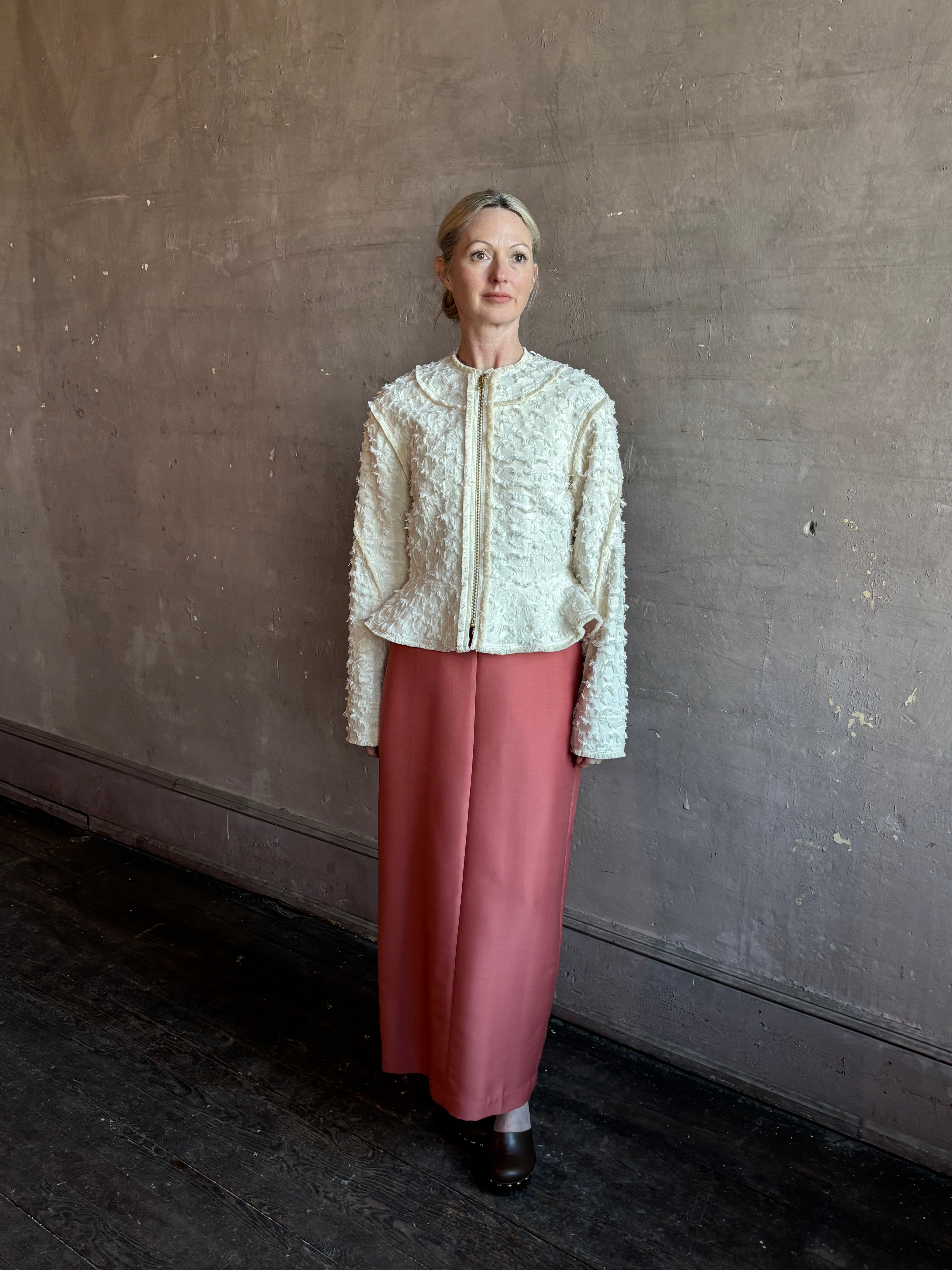 Image of woman wearing designer Ulla Johnson Rosalind tailored peplum Jacket in Premium Cotton with checkered fringe texture