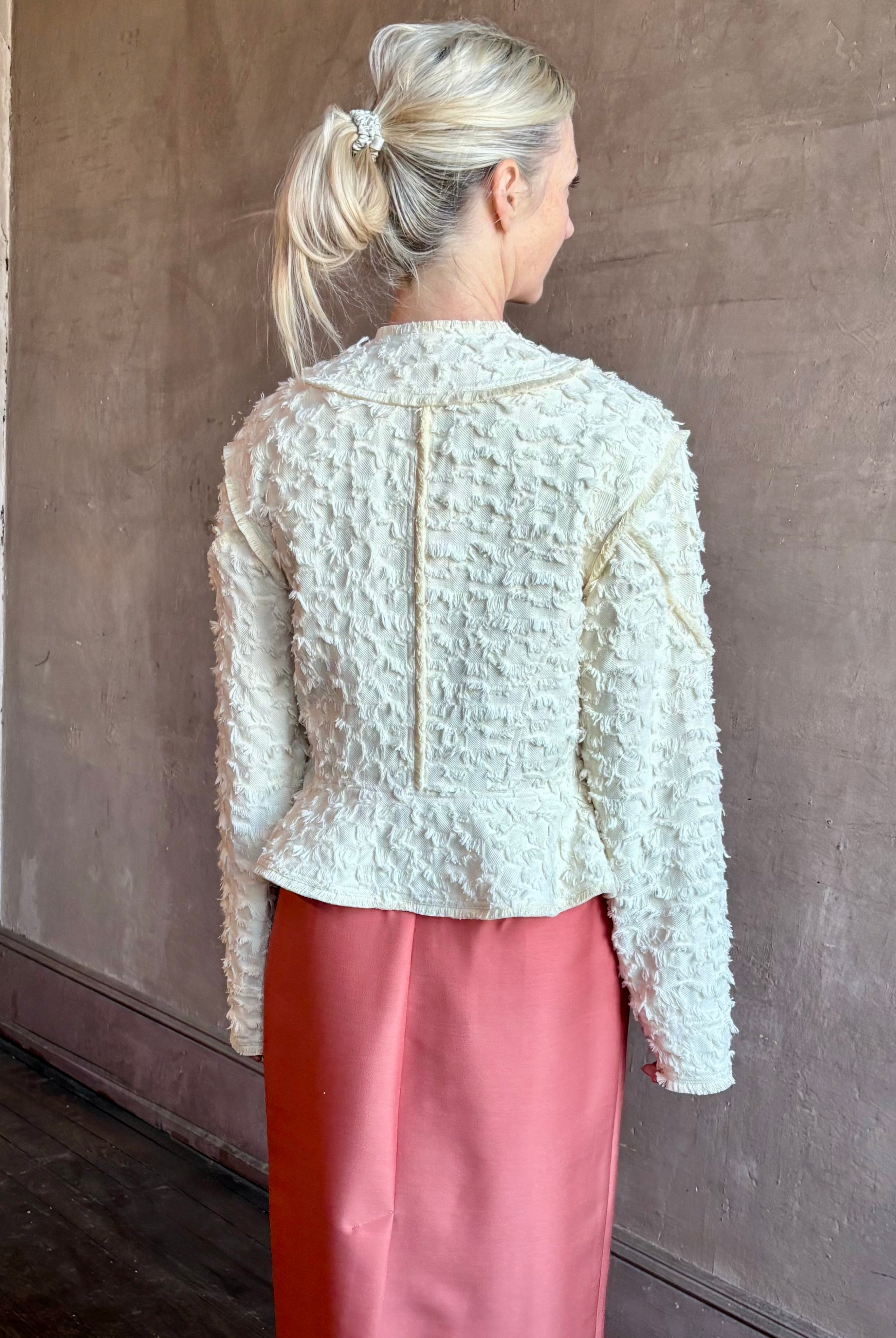 Image of woman wearing designer Ulla Johnson Rosalind tailored peplum Jacket in Premium Cotton with checkered fringe texture