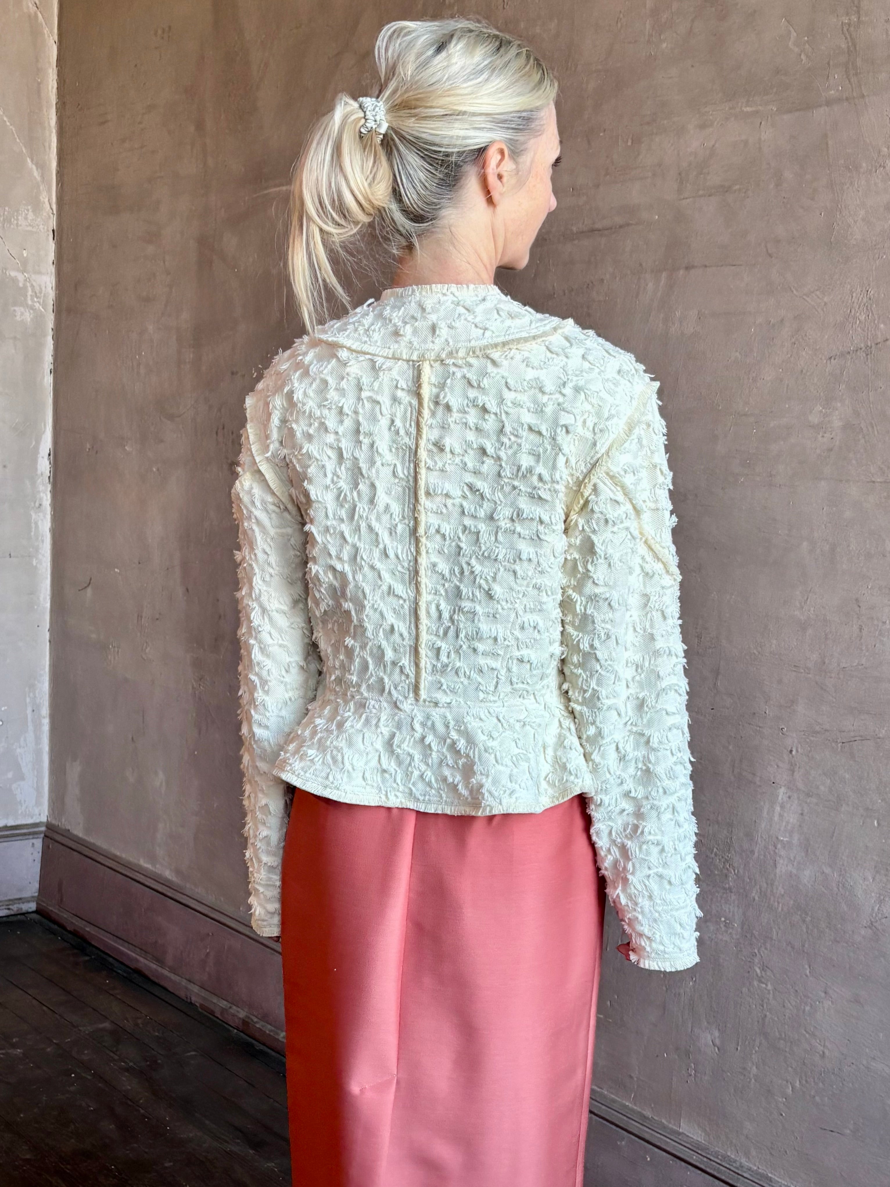 Image of woman wearing designer Ulla Johnson Rosalind tailored peplum Jacket in Premium Cotton with checkered fringe texture