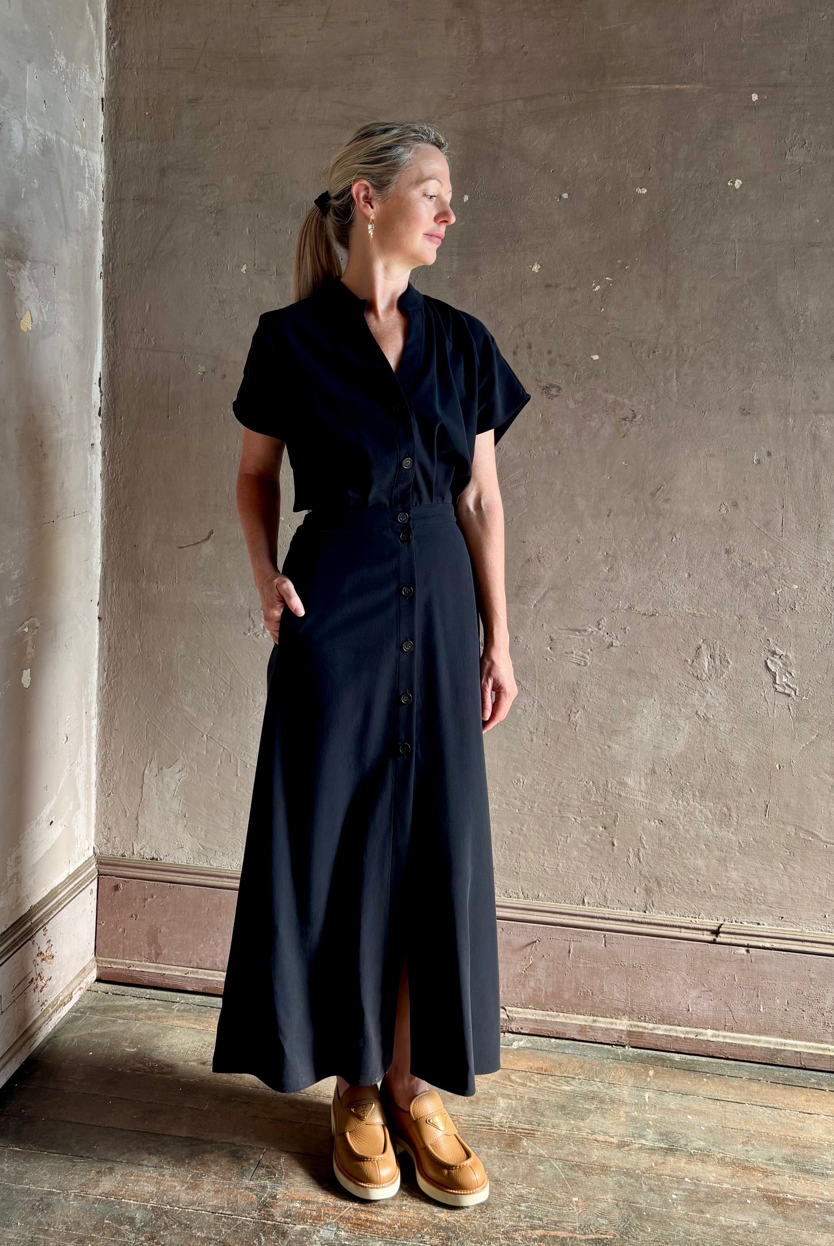 Woman wearing Vanessa Bruno classic button-front Cheryle maxi dress with open back detail short sleeve v-neck