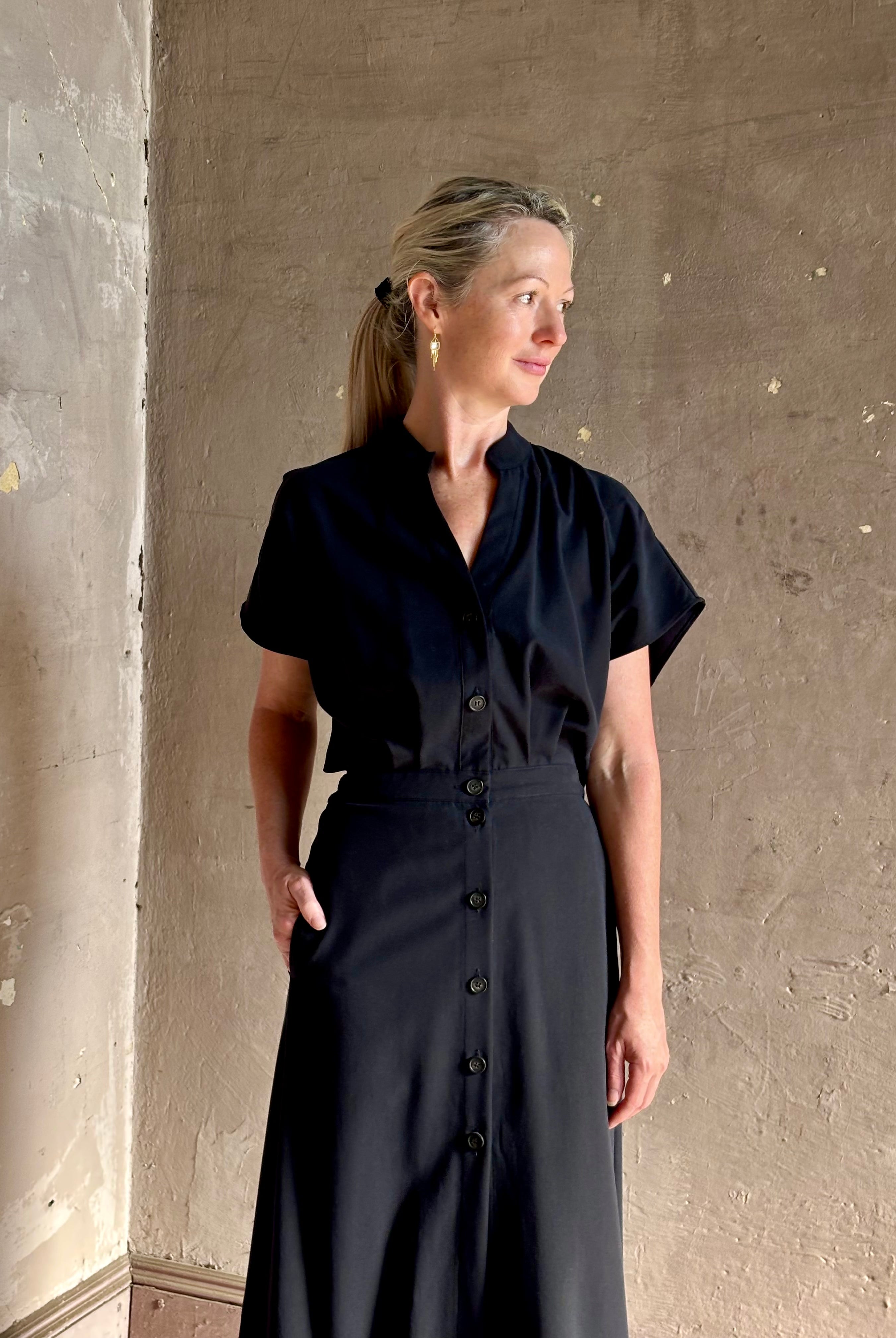 Woman wearing Vanessa Bruno classic button-front Cheryle maxi dress with open back detail short sleeve v-neck