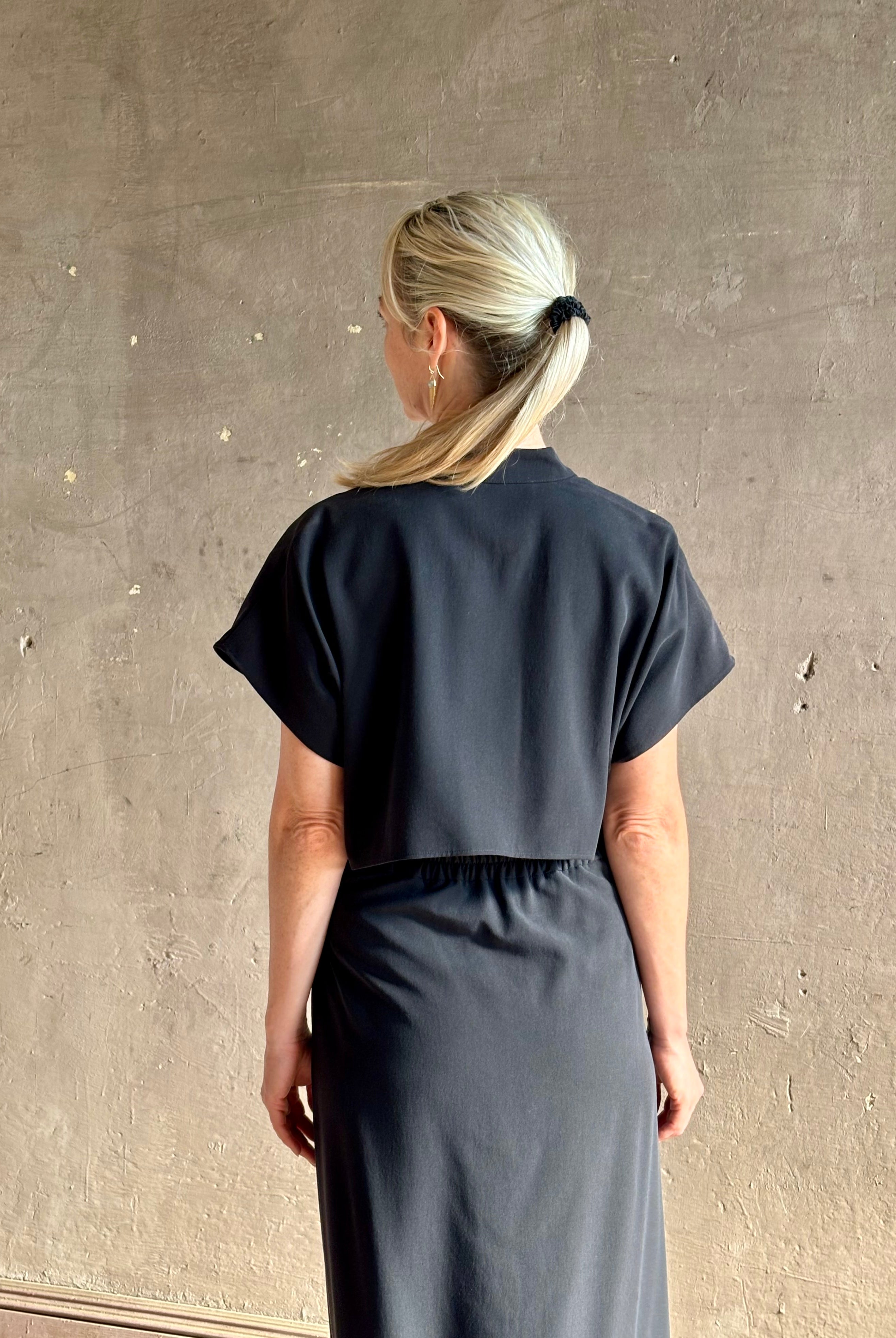 Woman wearing Vanessa Bruno classic button-front Cheryle maxi dress with open back detail short sleeve v-neck