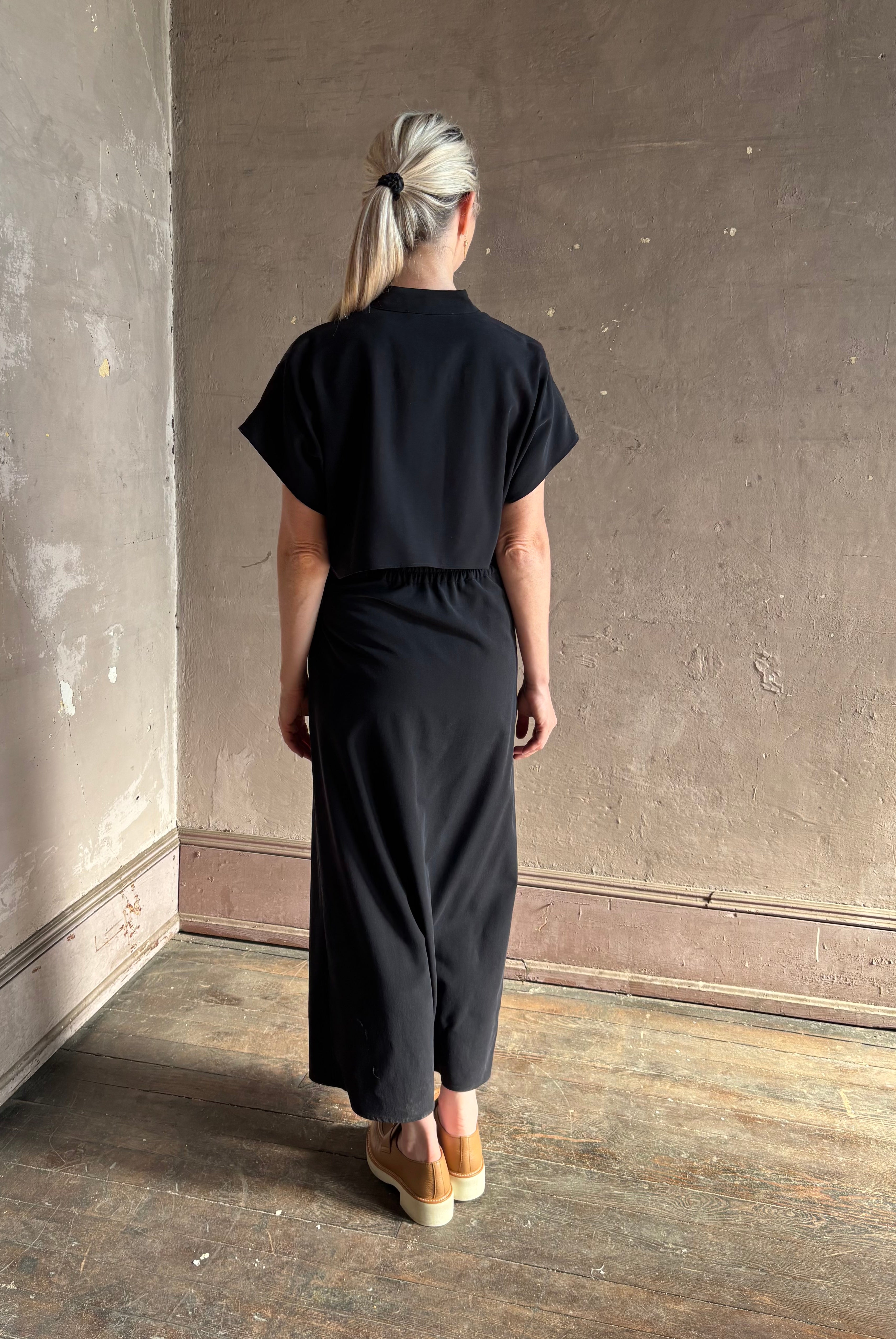 Woman wearing Vanessa Bruno classic button-front Cheryle maxi dress with open back detail short sleeve v-neck