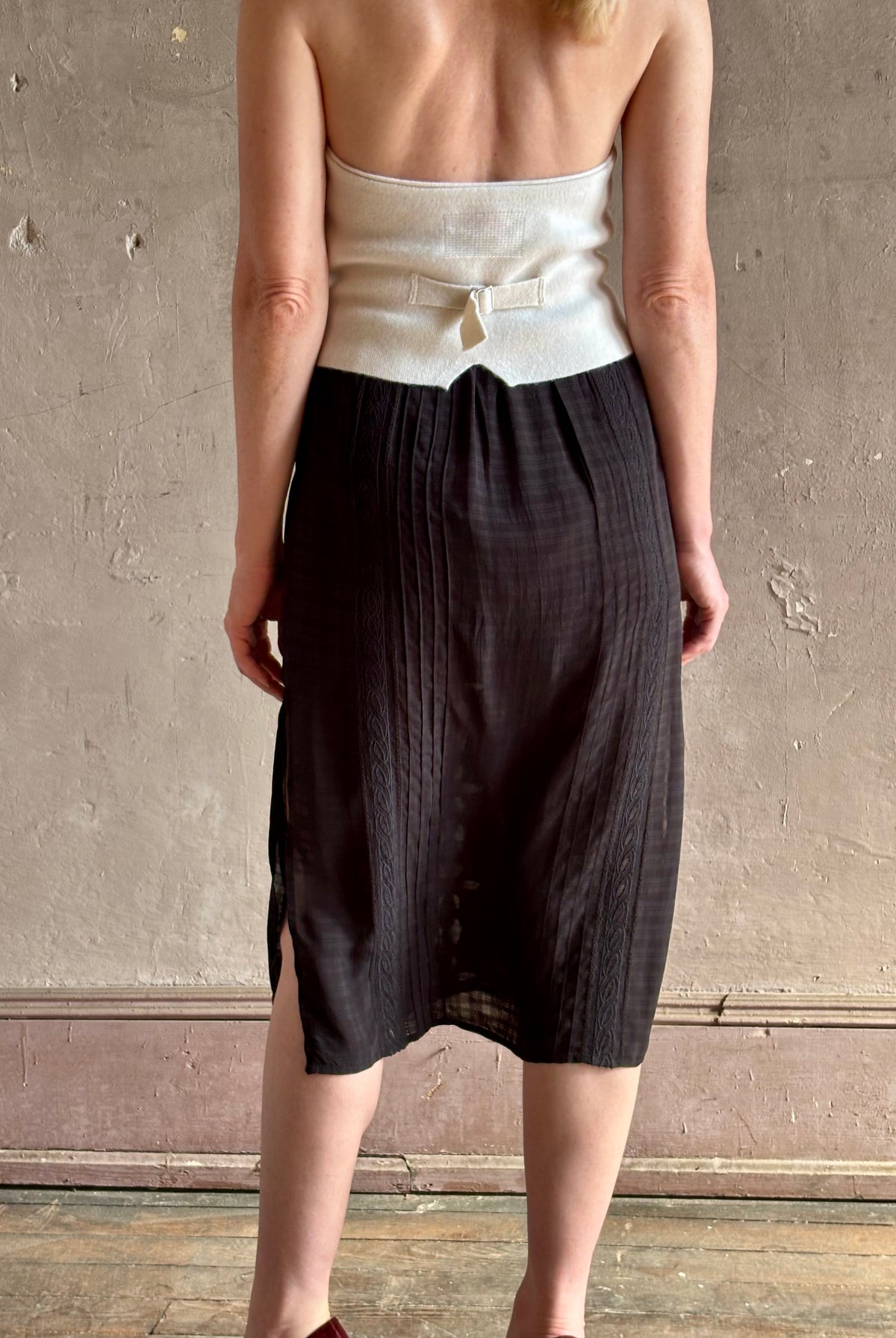 woman wearing Vanessa Bruno midi skirt semi-sheer jacquard black-on-black plaid delicate eyelet and pintucking