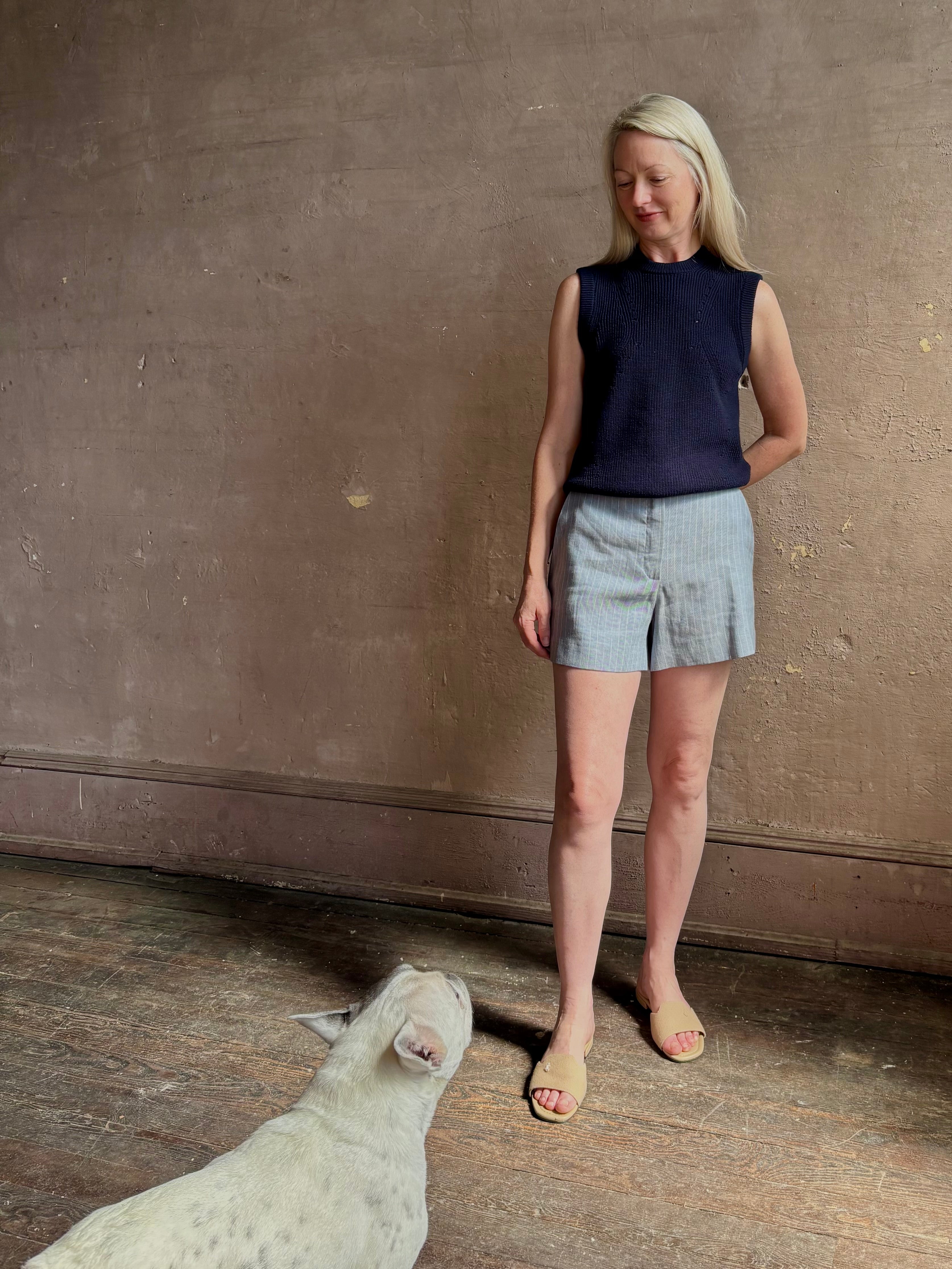 Woman wearing Vanessa Bruno Elisam elevated mid-rise tailored blue and white pinstripe short naturally breathable