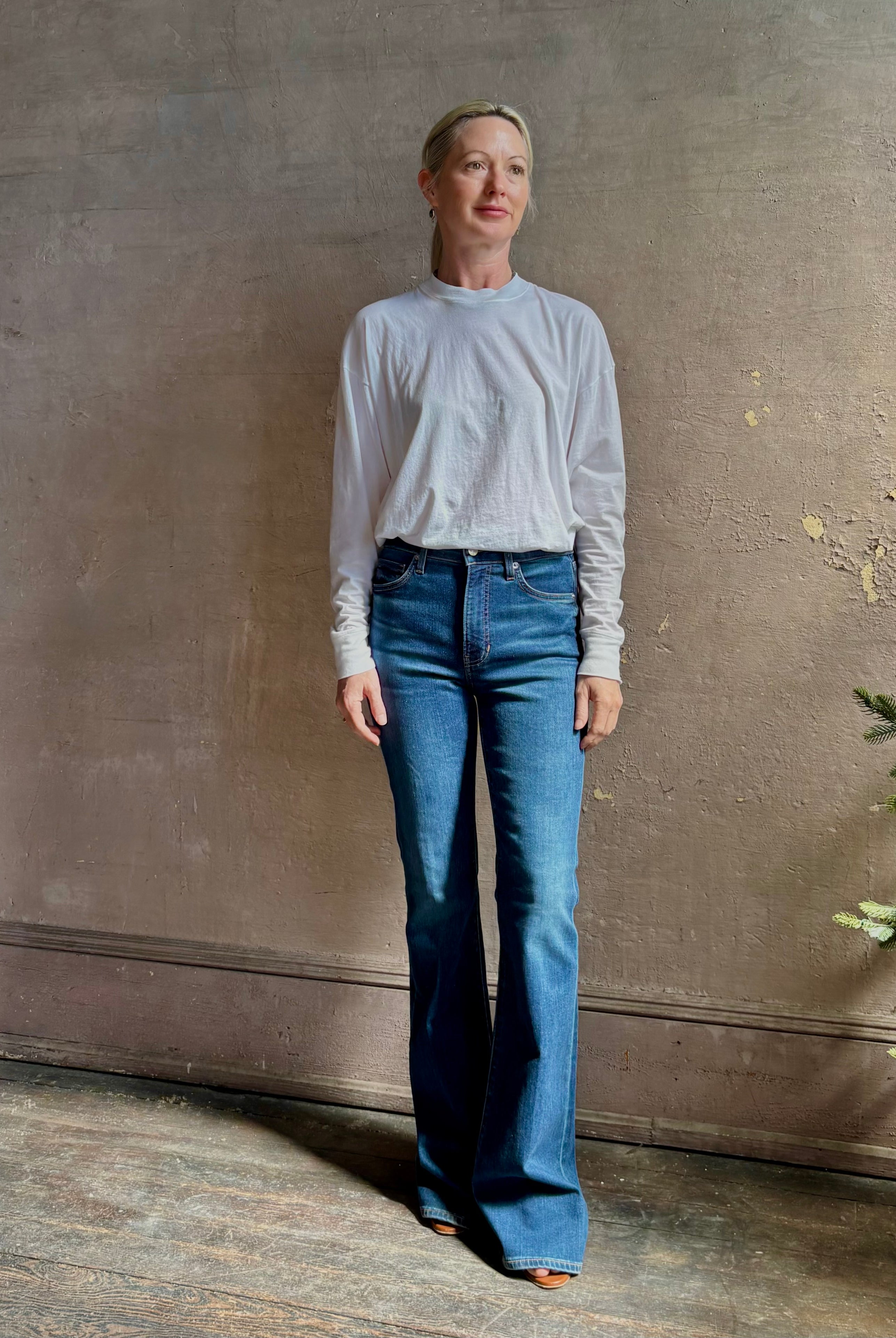 Mature woman wearing VERONICA BEARD BEVERLY JEANS medium wash| Women's Cotton Blend High-Rise Flared Leg