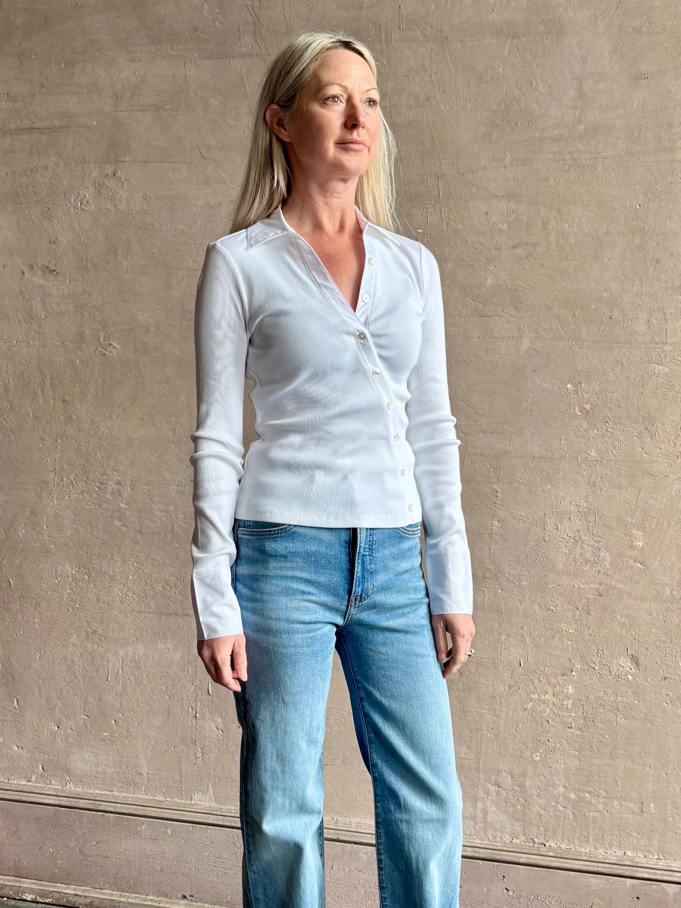 Image of mature woman wearing a VERONICA BEARD white Brenner Top in Premium Pima Cotton with v-neck and expert tailoring