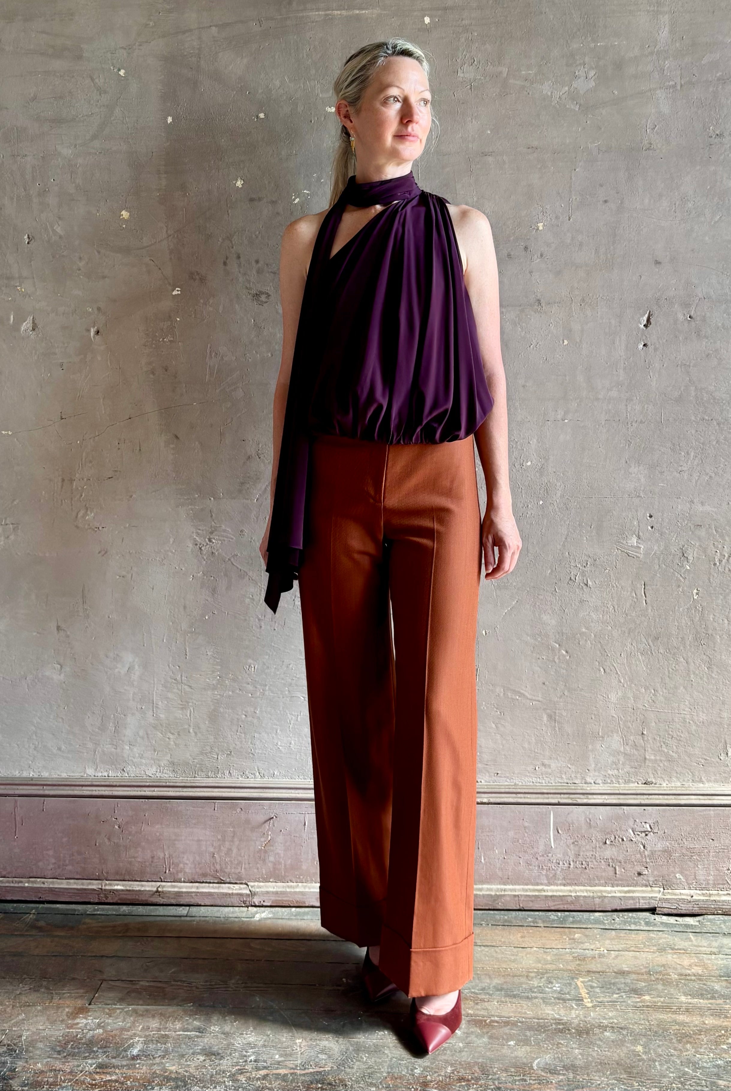 Mature woman wearing Veronica Beard Darell Pant comfortable stretch fitted waist wide leg cropped cuffed hemline
