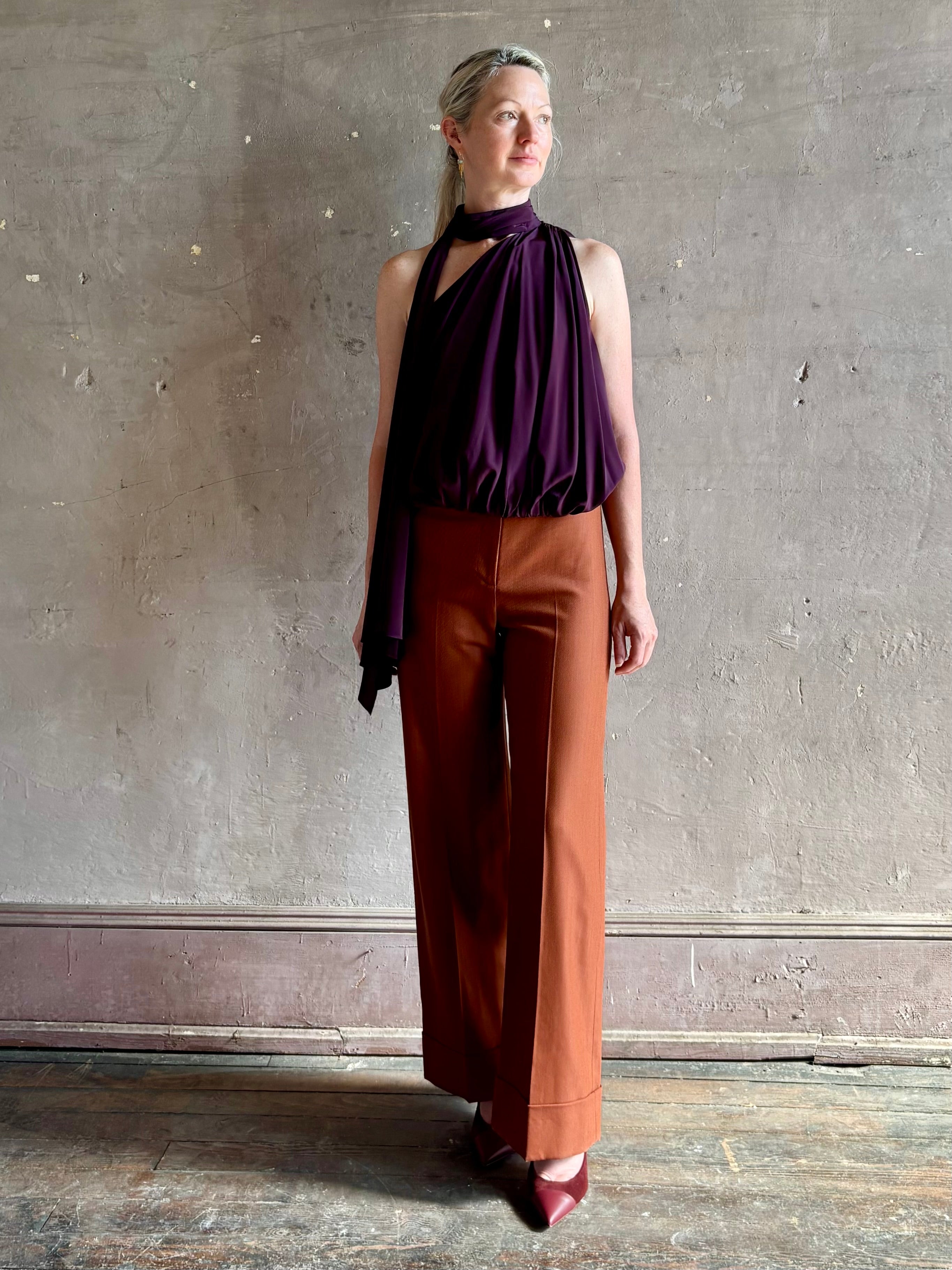 Mature woman wearing Veronica Beard Darell Pant comfortable stretch fitted waist wide leg cropped cuffed hemline