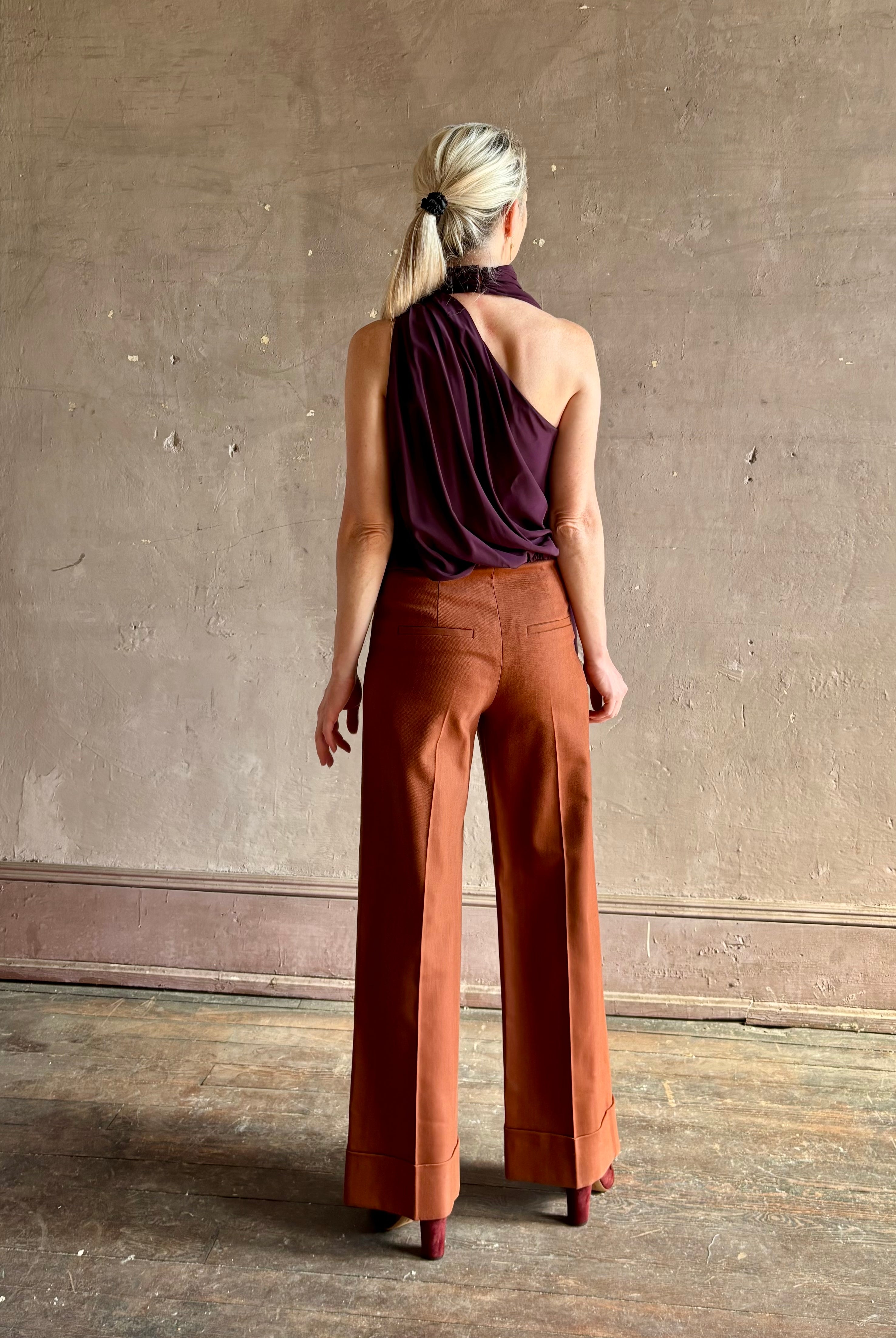 Mature woman wearing refined Veronica Beard Darell Pant high-rise wide leg cropped length cuffed hemline