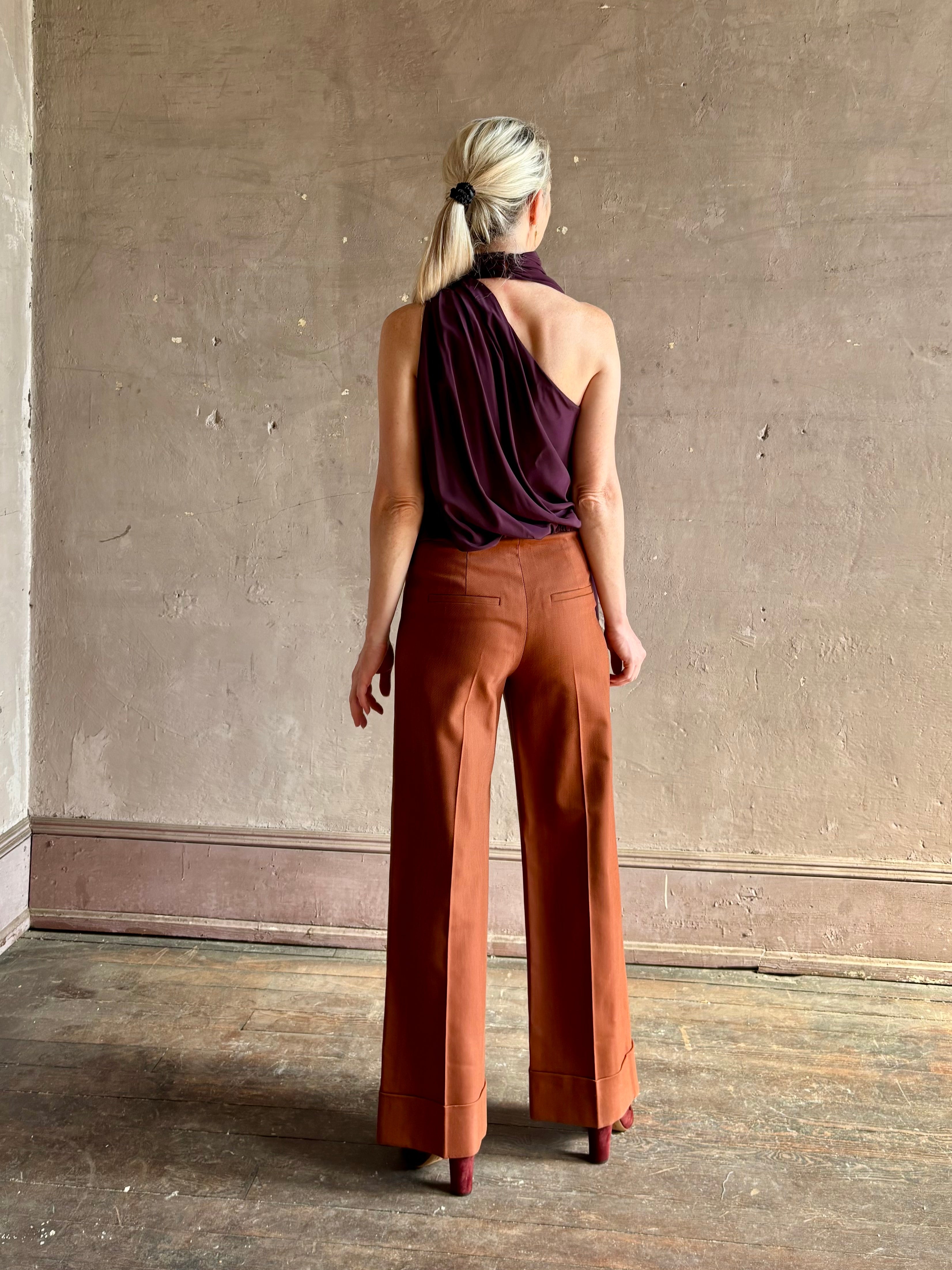 Mature woman wearing refined Veronica Beard Darell Pant high-rise wide leg cropped length cuffed hemline