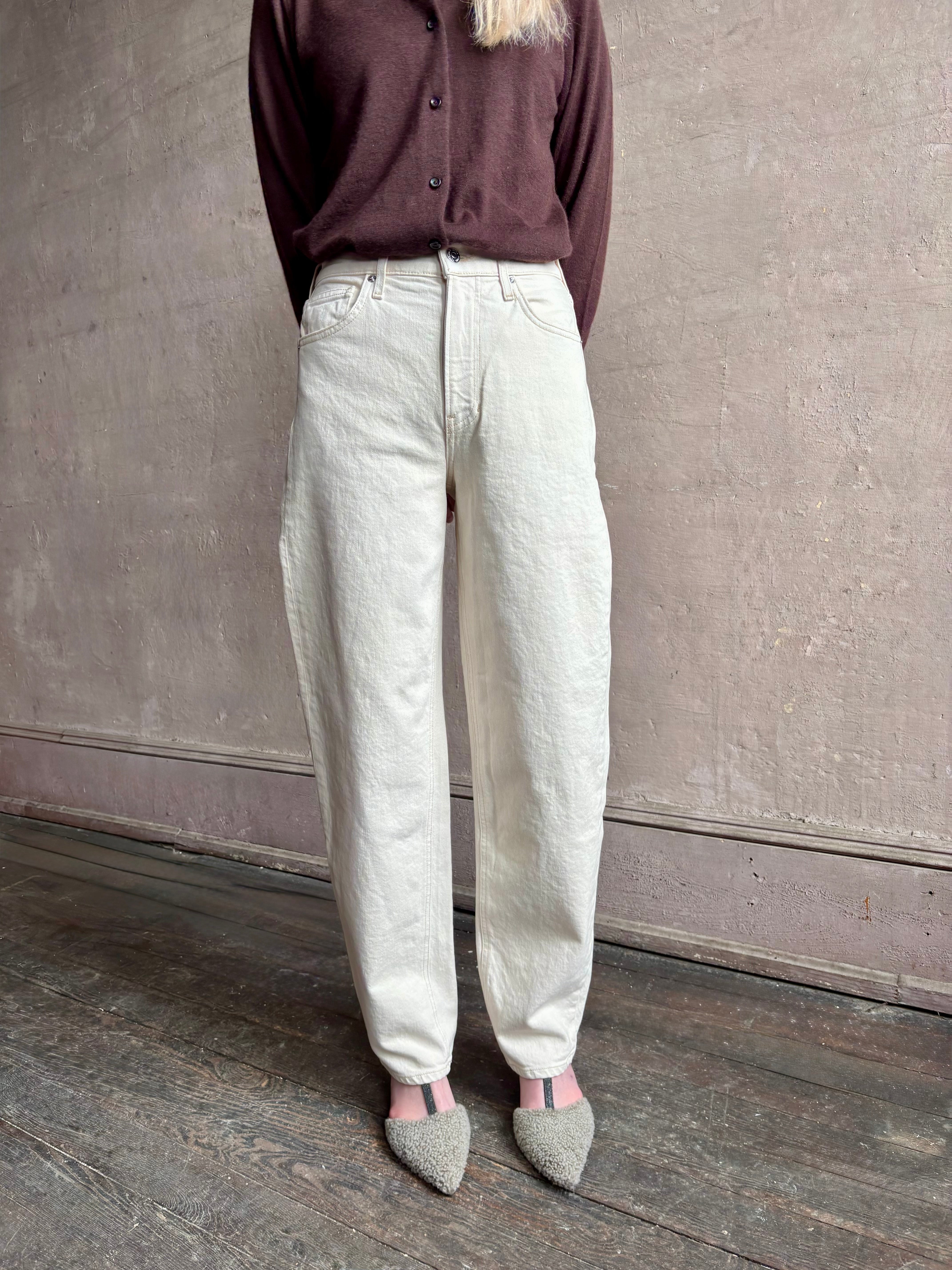 Image of woman wearing VERONICA BEARD Harley Arc Leg Jean in Ecru with Premium Cotton denim made in American for ultimate casual elegance