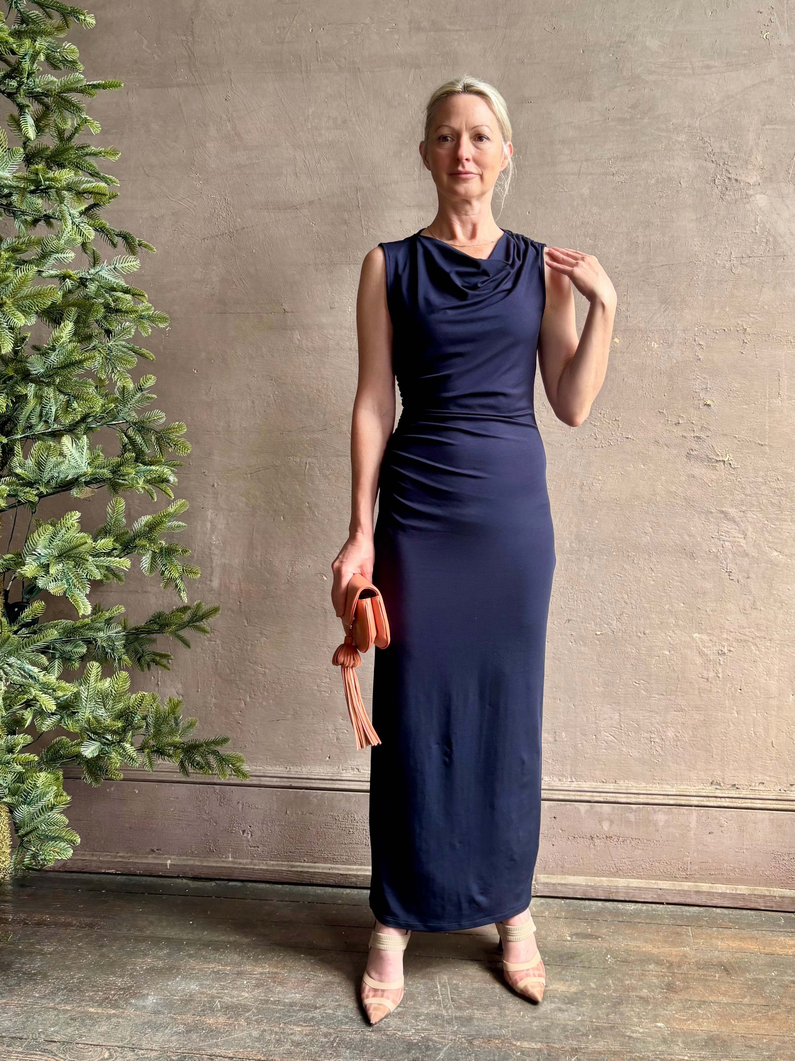 Mature woman wearing VERONICA BEARD Kerilyn navy blue maxi sheath Dress in a comfortable elevated casual wear fabric