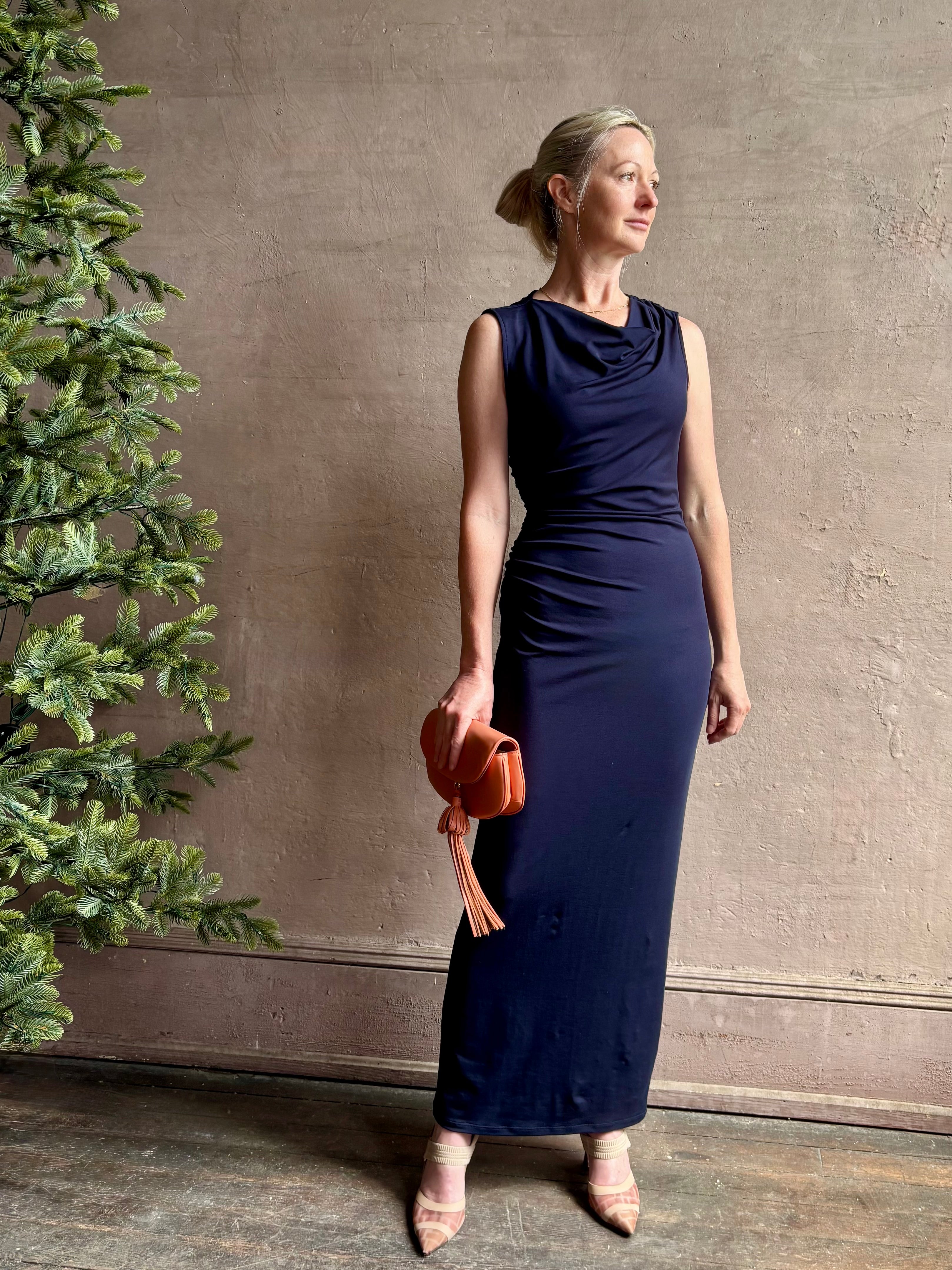 Mature woman wearing VERONICA BEARD Kerilyn navy blue maxi sheath Dress in a comfortable elevated casual wear fabric