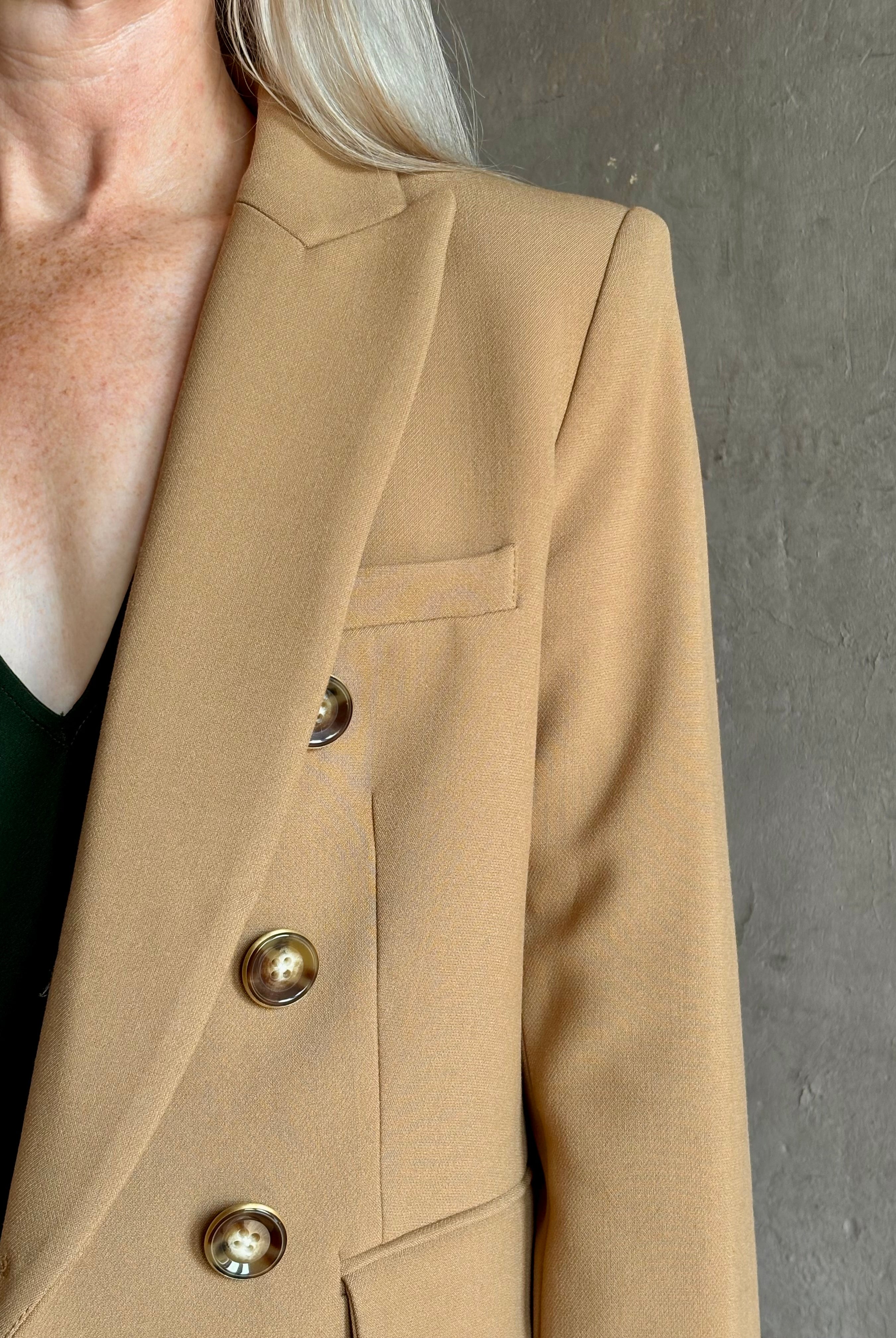 Mature woman wearing Veronica Beard Miller Dickey Jacket in Heritage Khaki tailored blazer flattering back darts