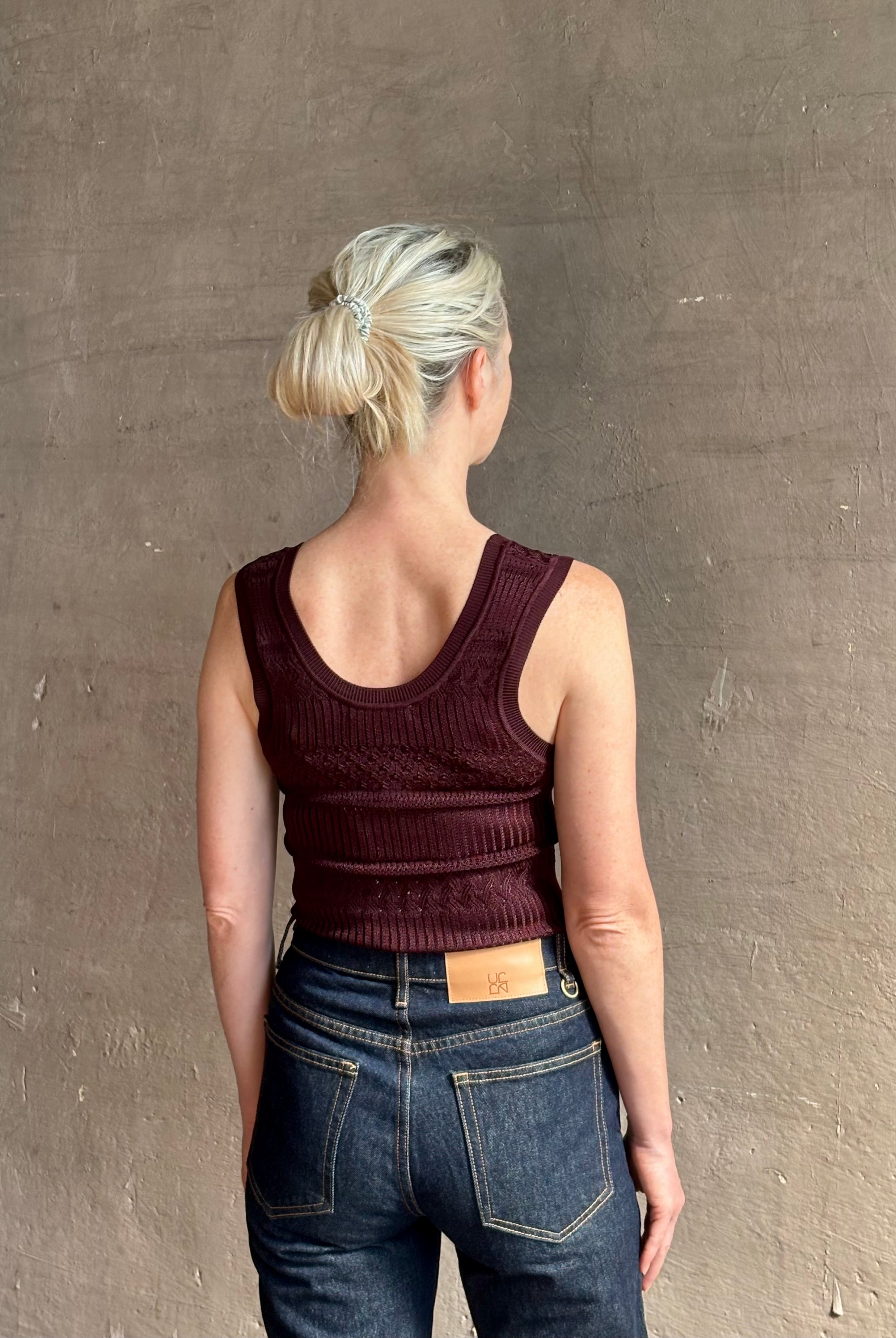 Sandra Tank from Veronica Beard rendered in a rich mulberry tone with detailed weaved and scoop back