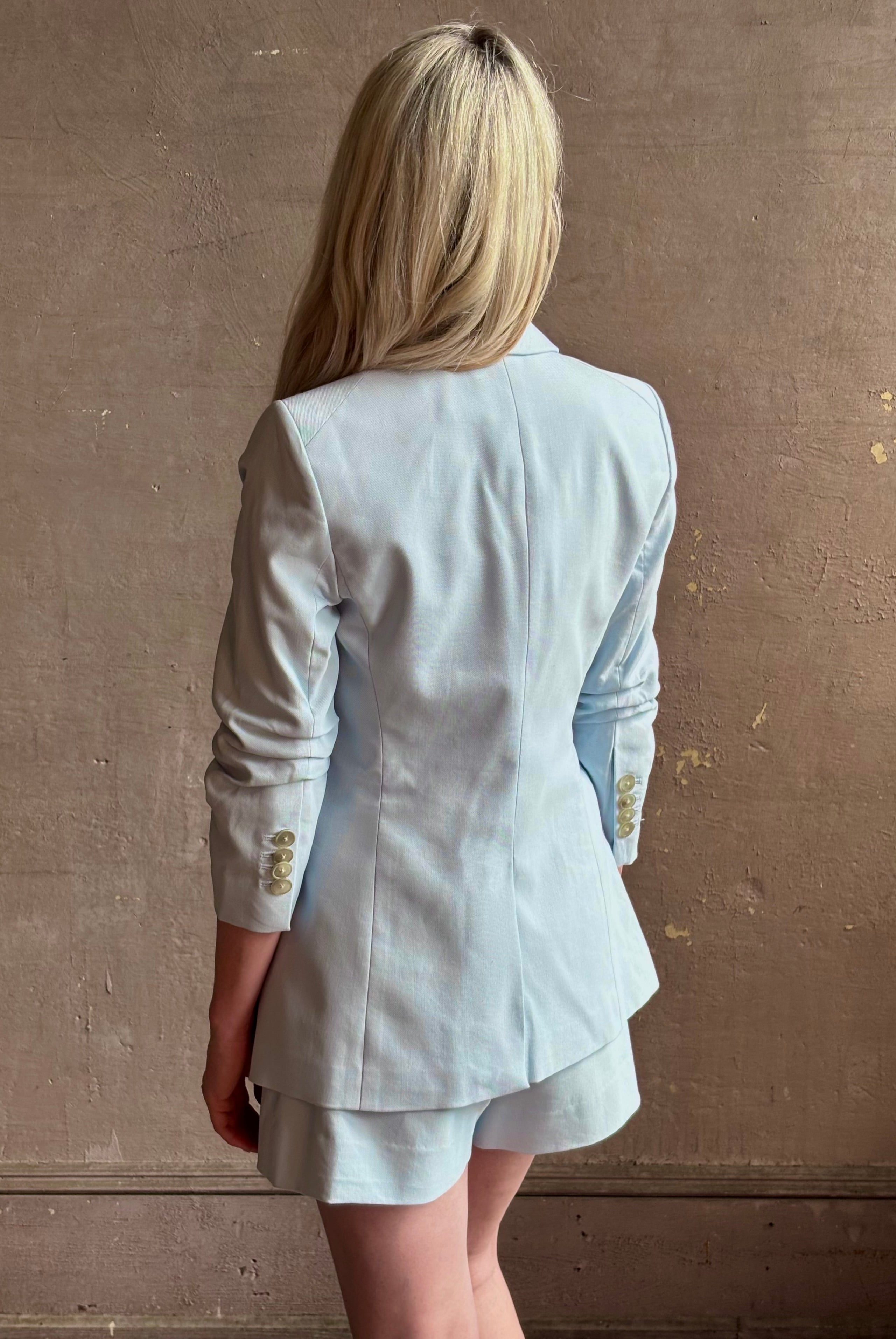 Mature woman wearing tailored Veronica Beard Tomi Dickey Jacket with button front optional zip in accessories cupro lining