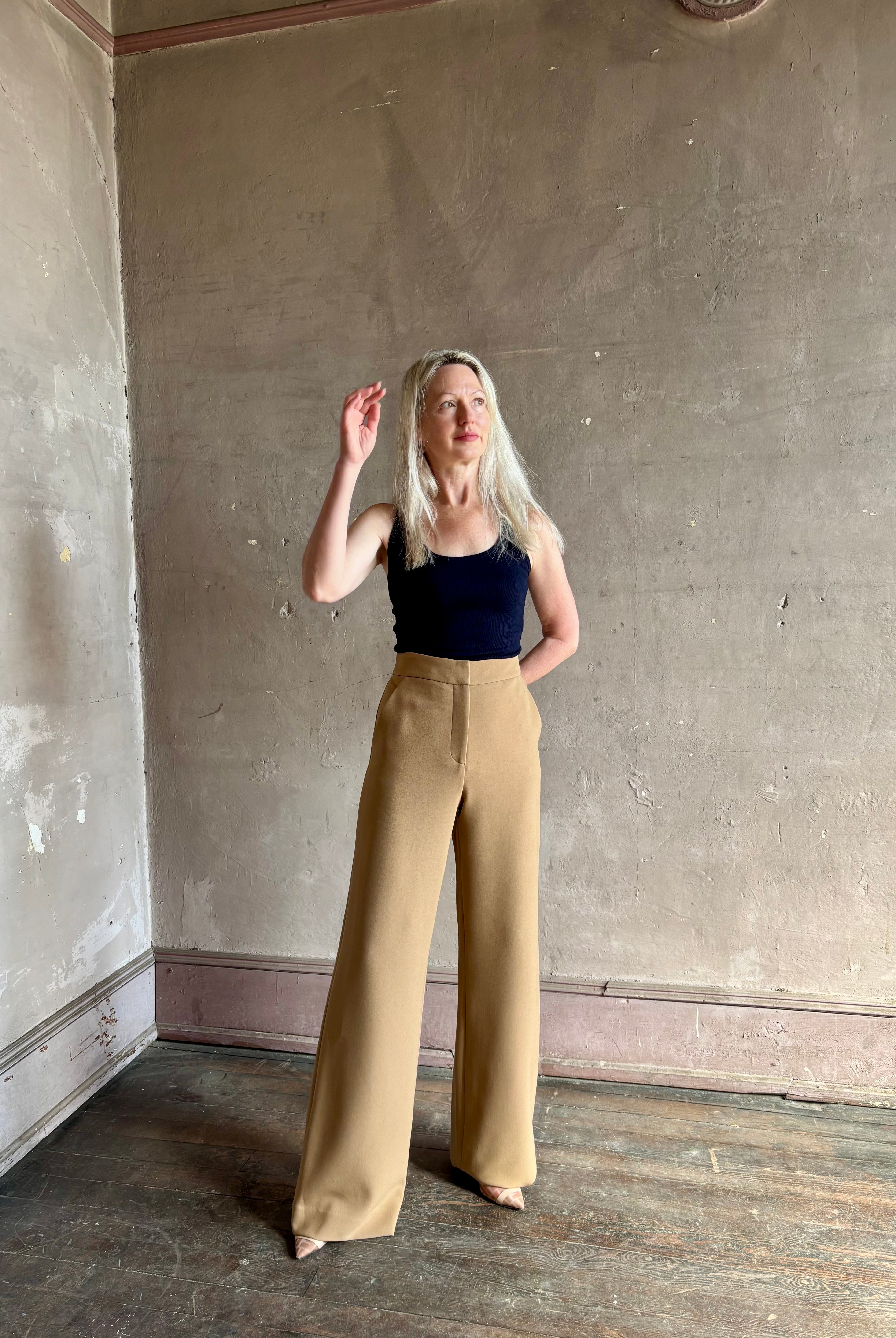 Woman wearing Veronica Beard Tonelli Pant Heritage Khaki flat-front beltless tailored trouser made in America