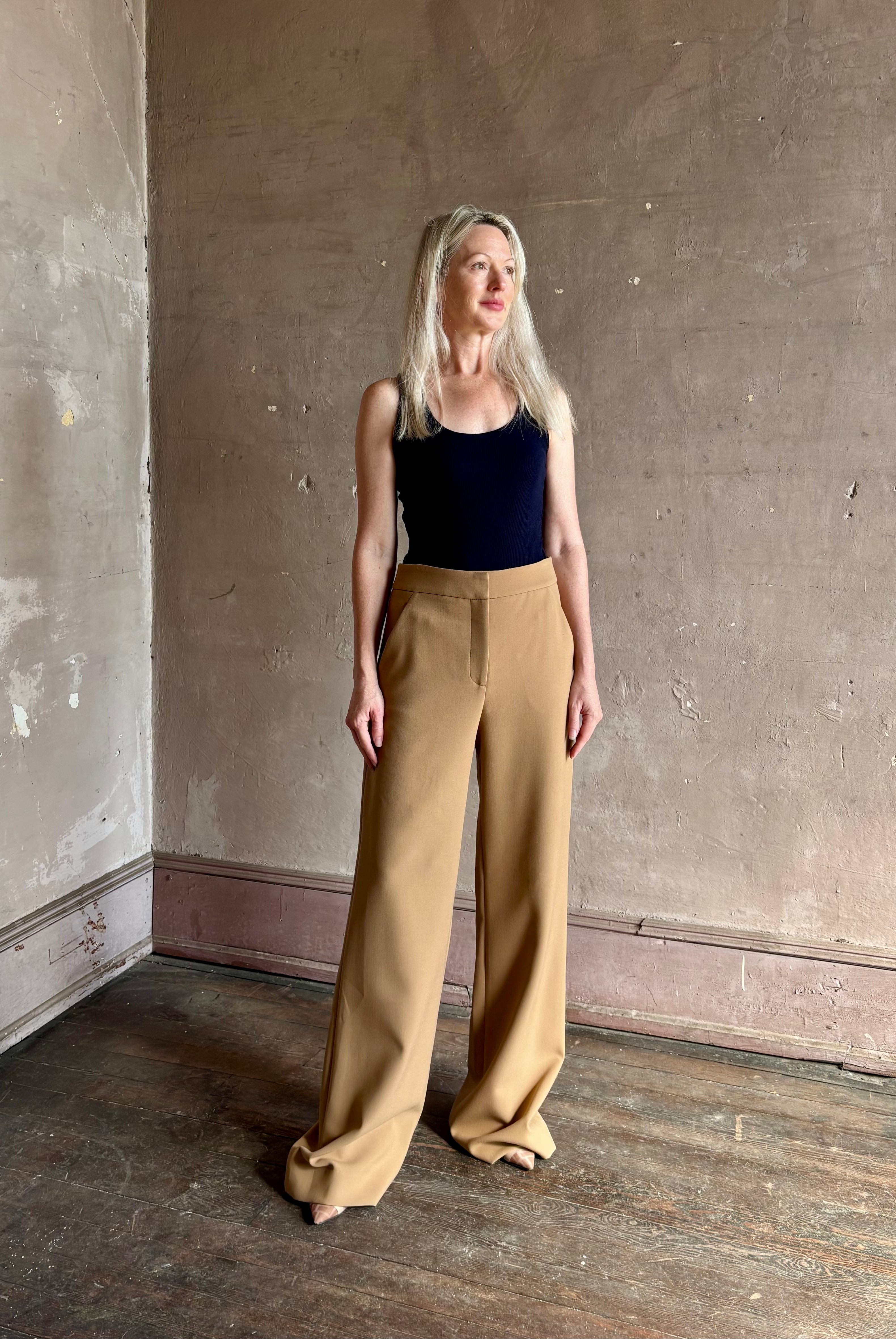 Woman wearing Veronica Beard Tonelli Pant Heritage Khaki flat-front beltless tailored trouser made in America
