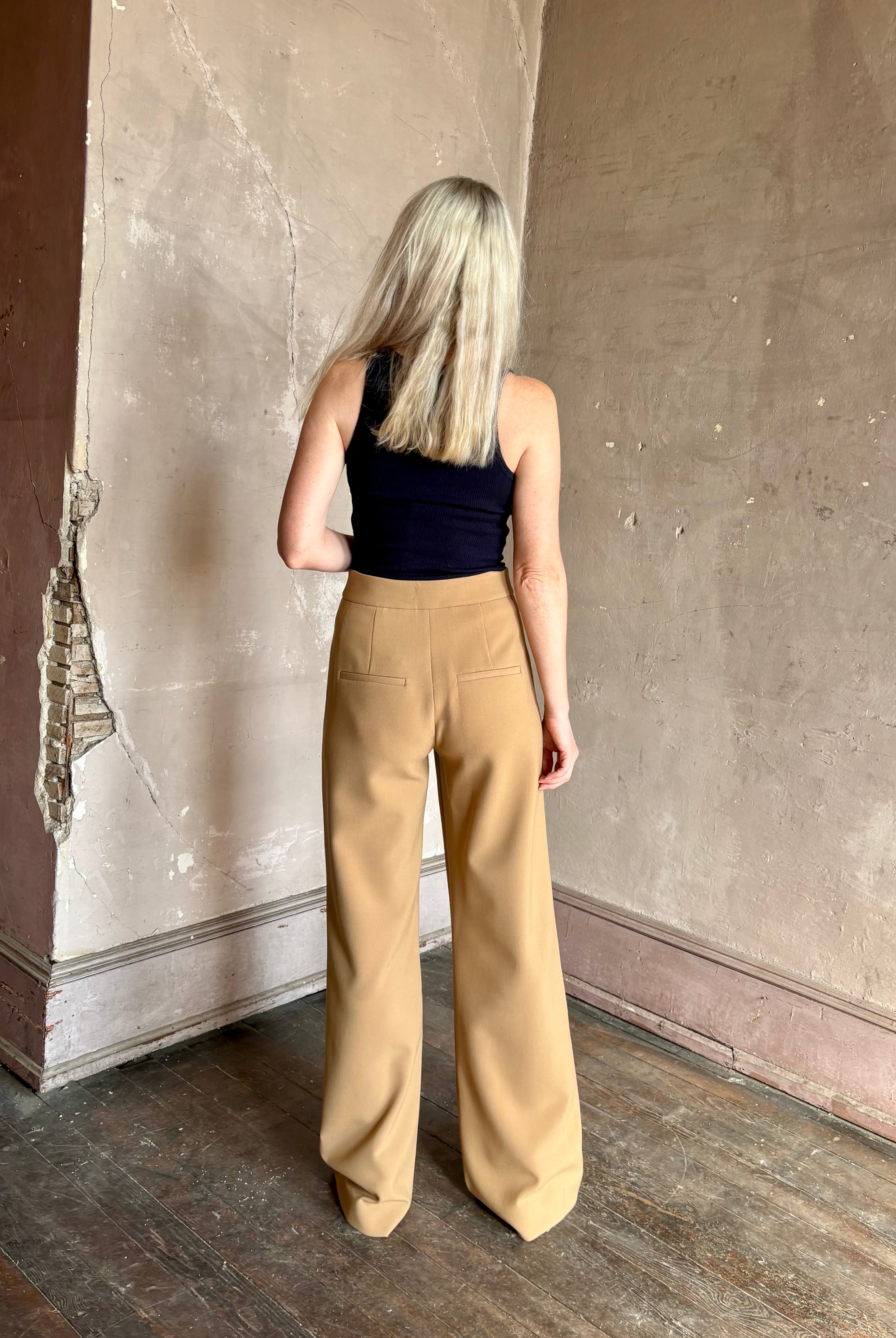 Woman wearing Veronica Beard Tonelli Pant Heritage Khaki flat-front beltless tailored trouser made in America