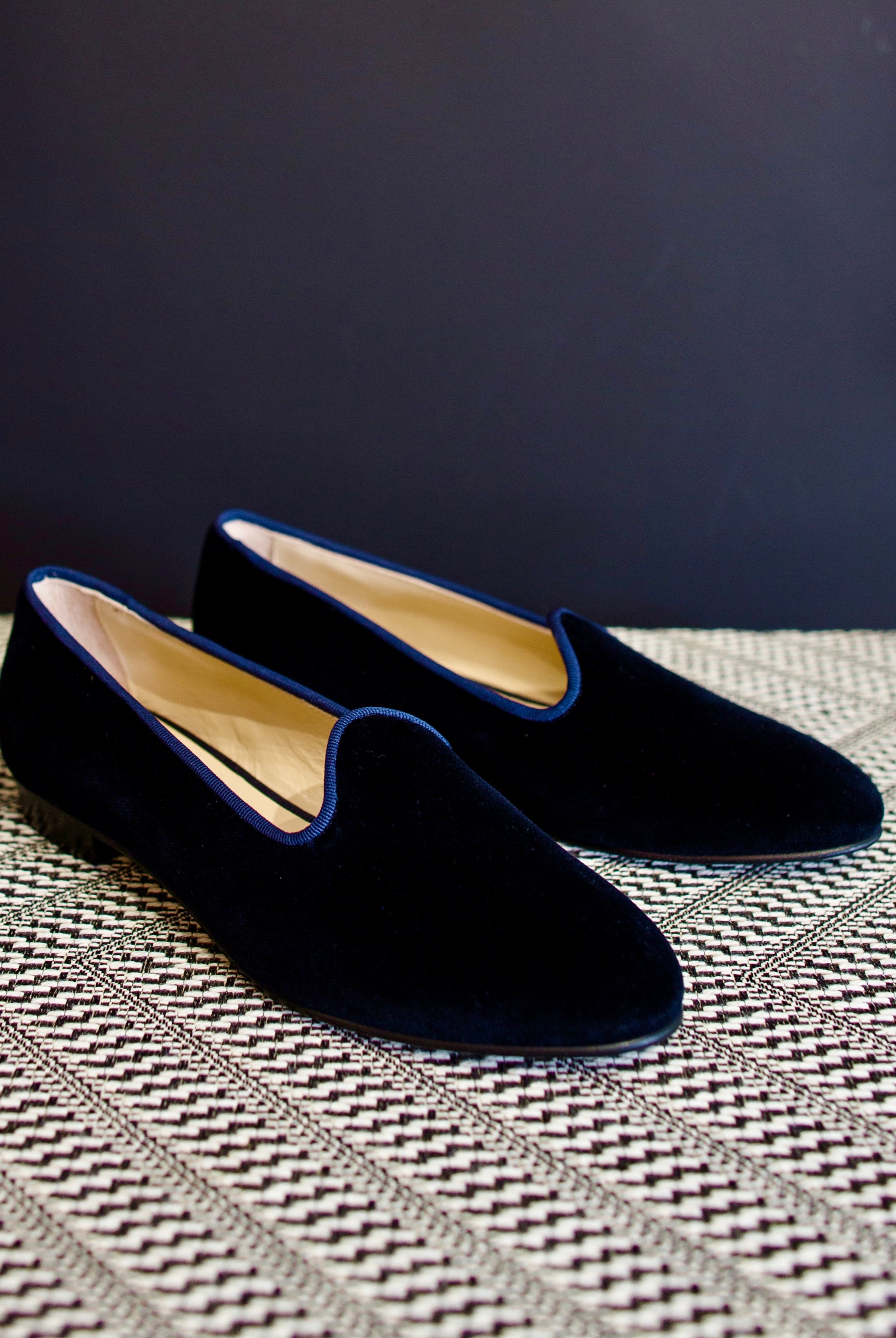 Image featuring blue velvet loafers by Vibi Venezia with an almond toe, grosgrain trim and a slip on fit. They have a leather sole.