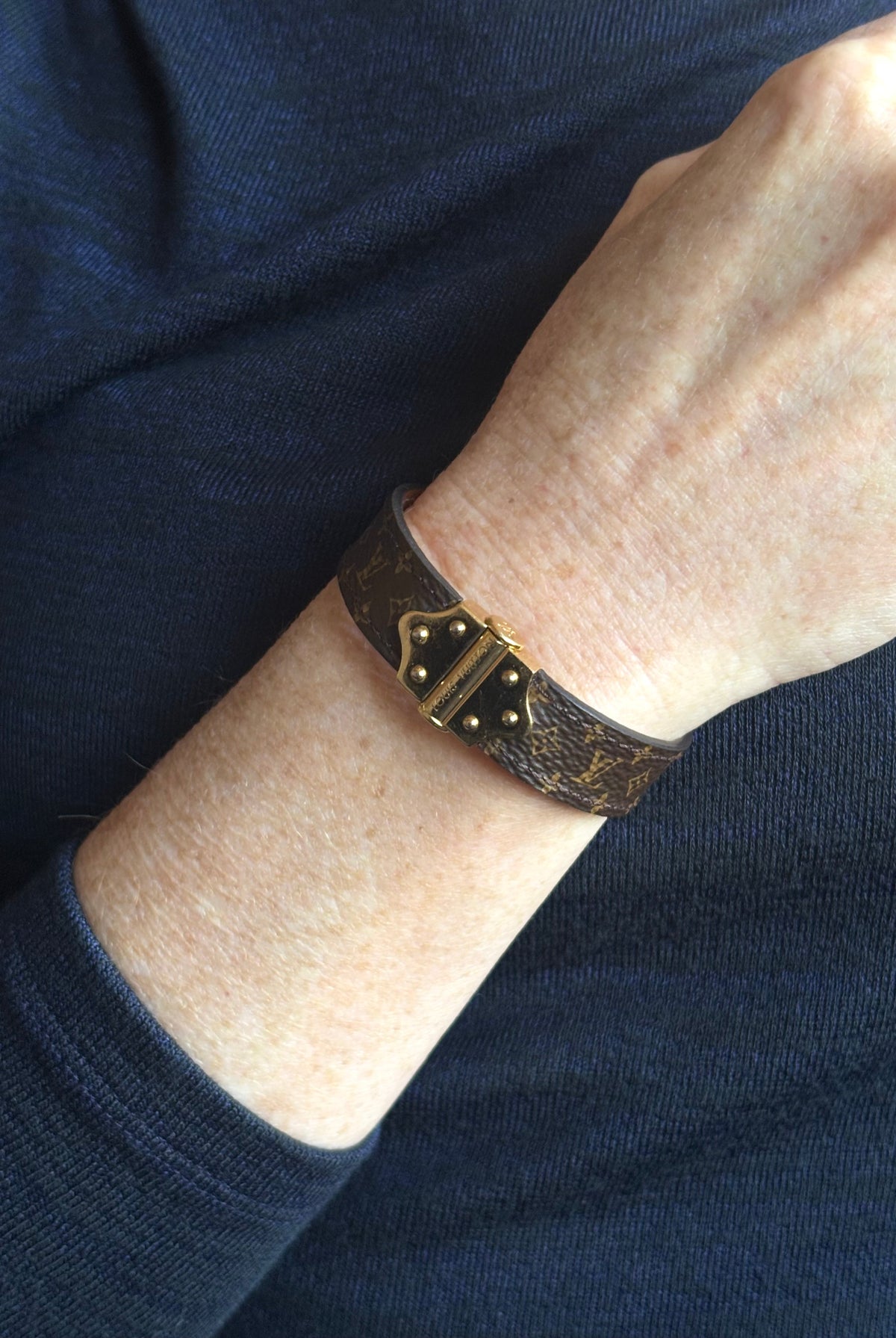 Louis Vuitton Spirit Nano Monogram Bracelet Monogram canvas engraved golden cylinder hinge closure Pre-owned