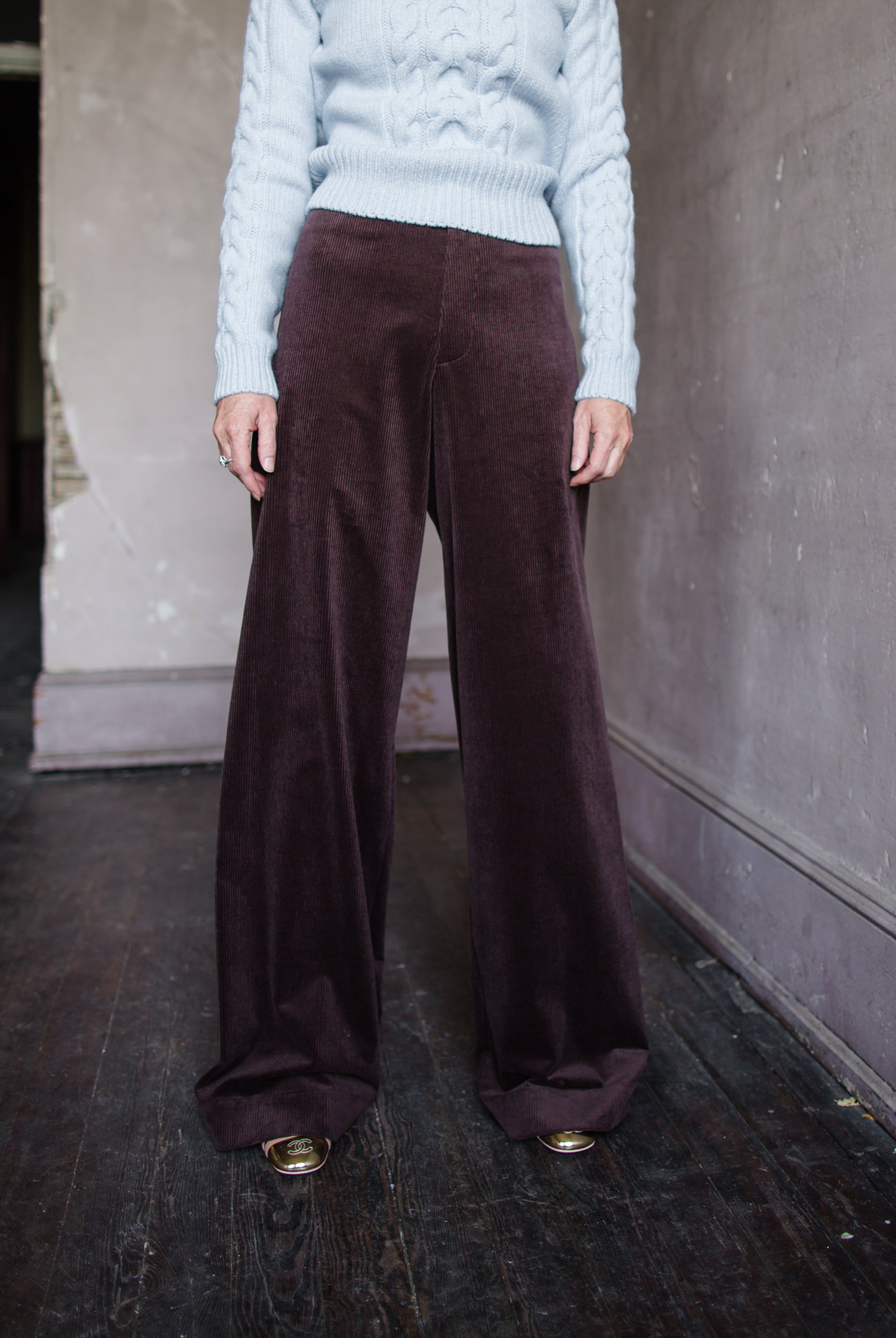 Image featuring a woman wearing the Dael cotton blend corduroy pants by Vanessa Bruno with a mid rise and wide leg in chocolate brown color.