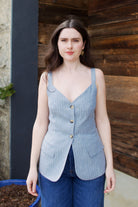 Woman wearing the Vanessa Bruno Elai Top V neckline with thin straps and tailored fit for timeless elegance and expert Parisian craftsmanship