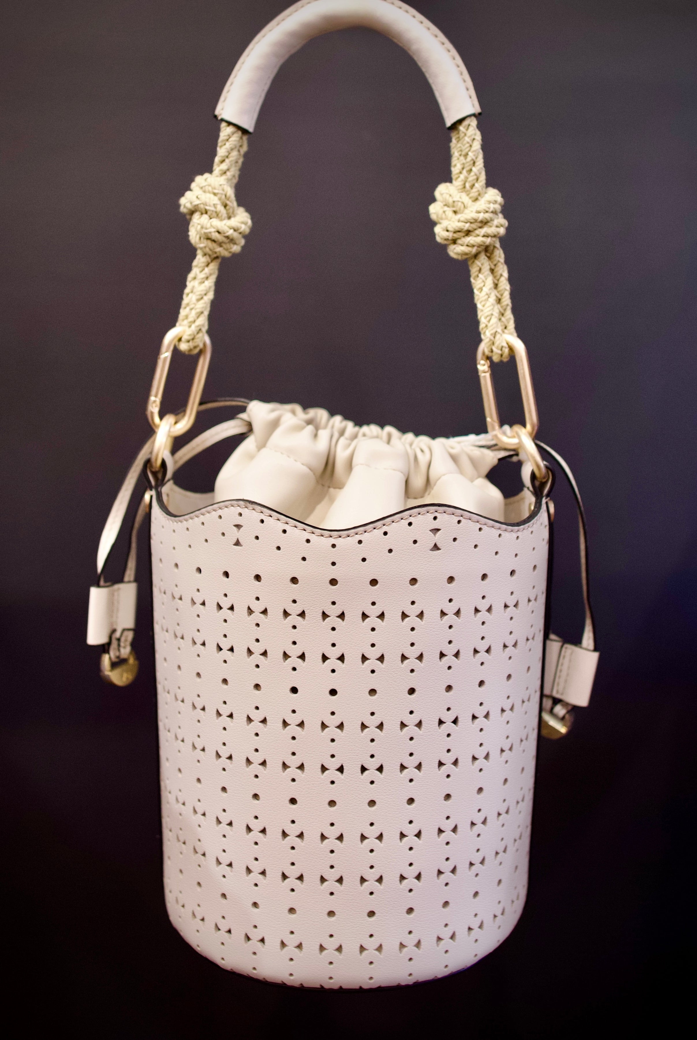Image of designer vanessa bruno holly mini seau ivory handbag with premium perforated leather construction and modern elegance