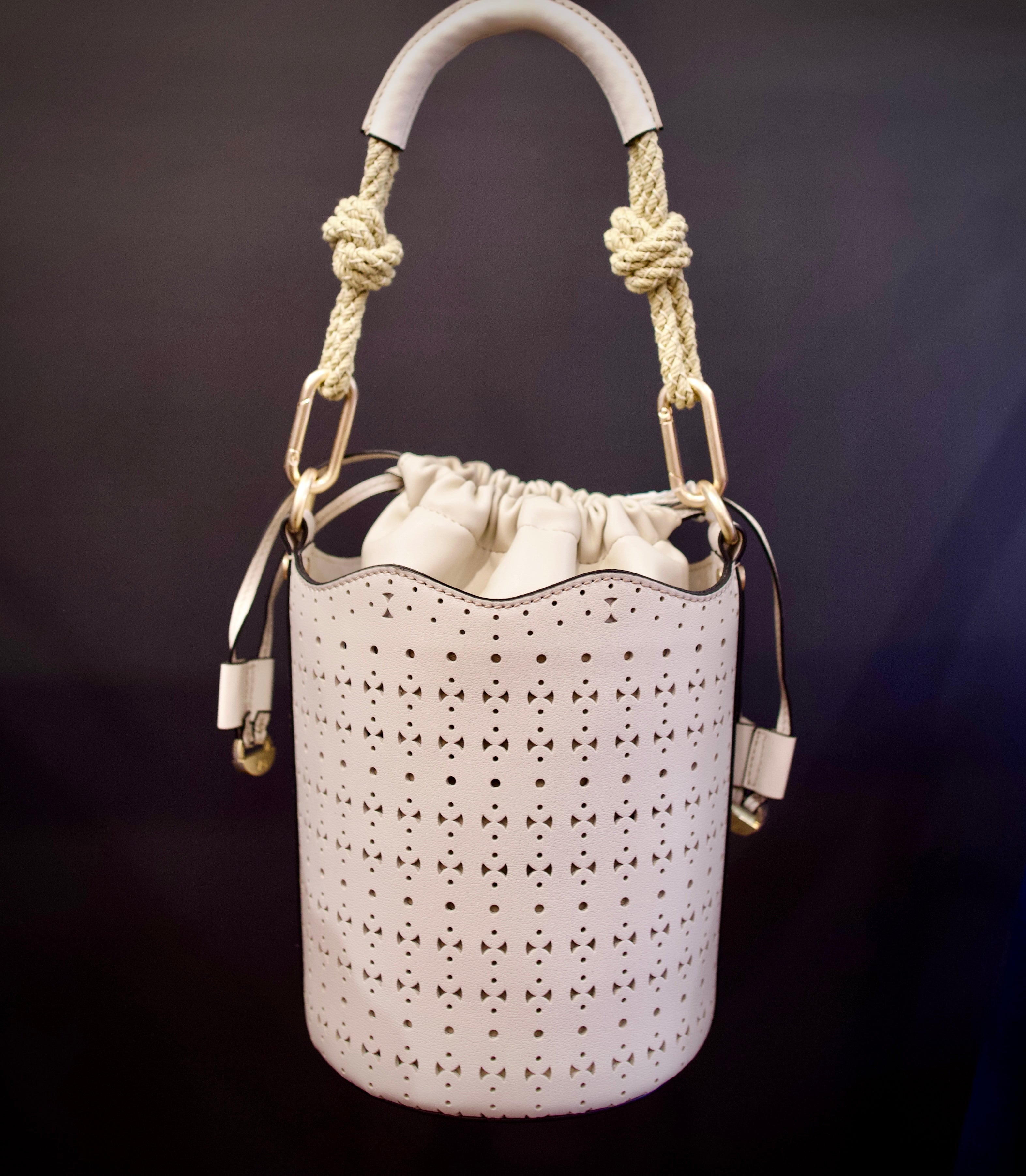 Image of designer vanessa bruno holly mini seau ivory handbag with premium perforated leather construction and modern elegance